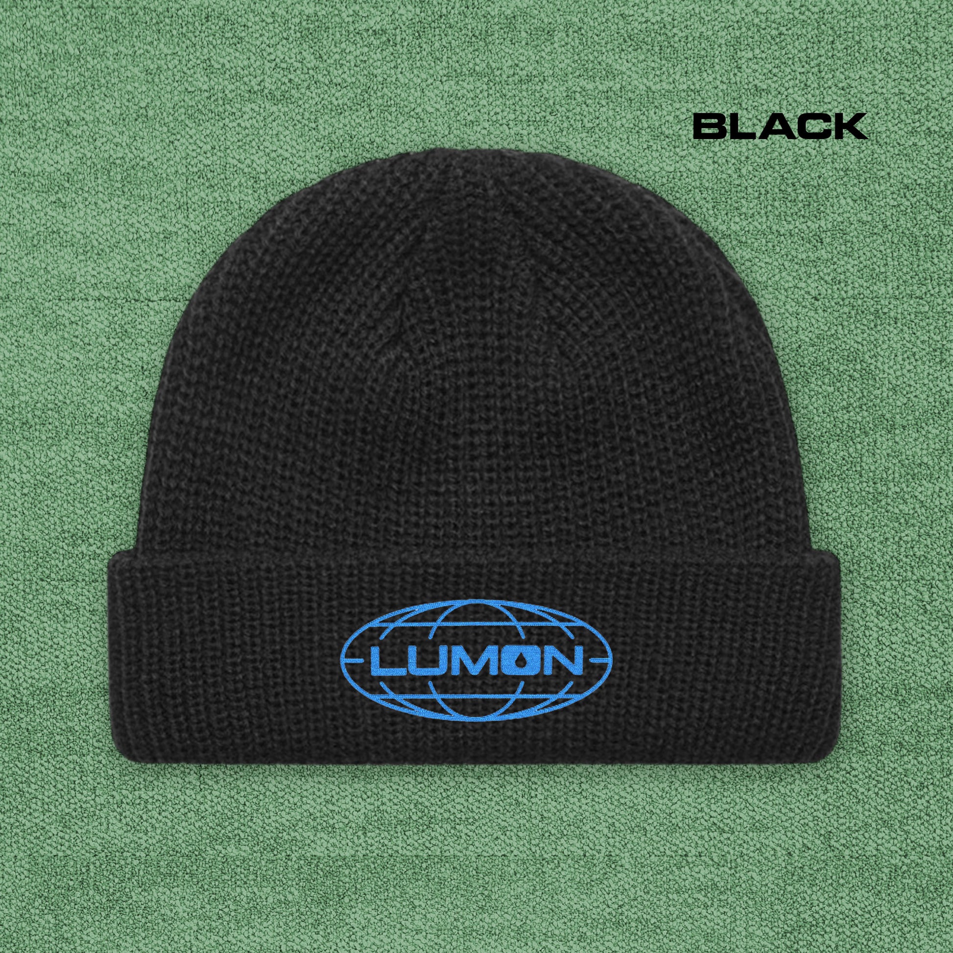 Black AS Colour cuff beanie with embroidered blue Lumon Industries logo from Severance, fisherman-style ribbed knit hat.