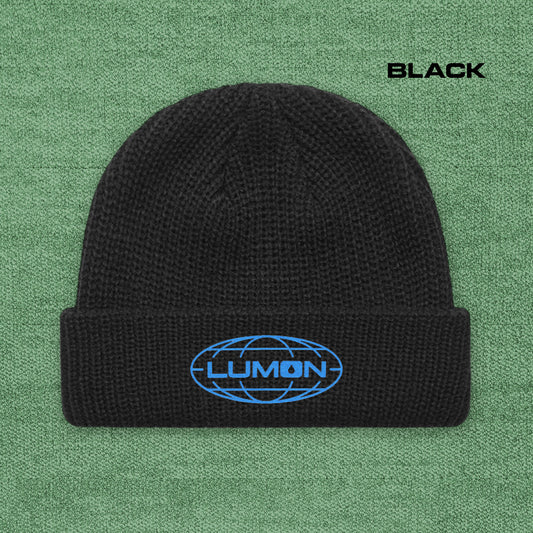Black AS Colour cuff beanie with embroidered blue Lumon Industries logo from Severance, fisherman-style ribbed knit hat.