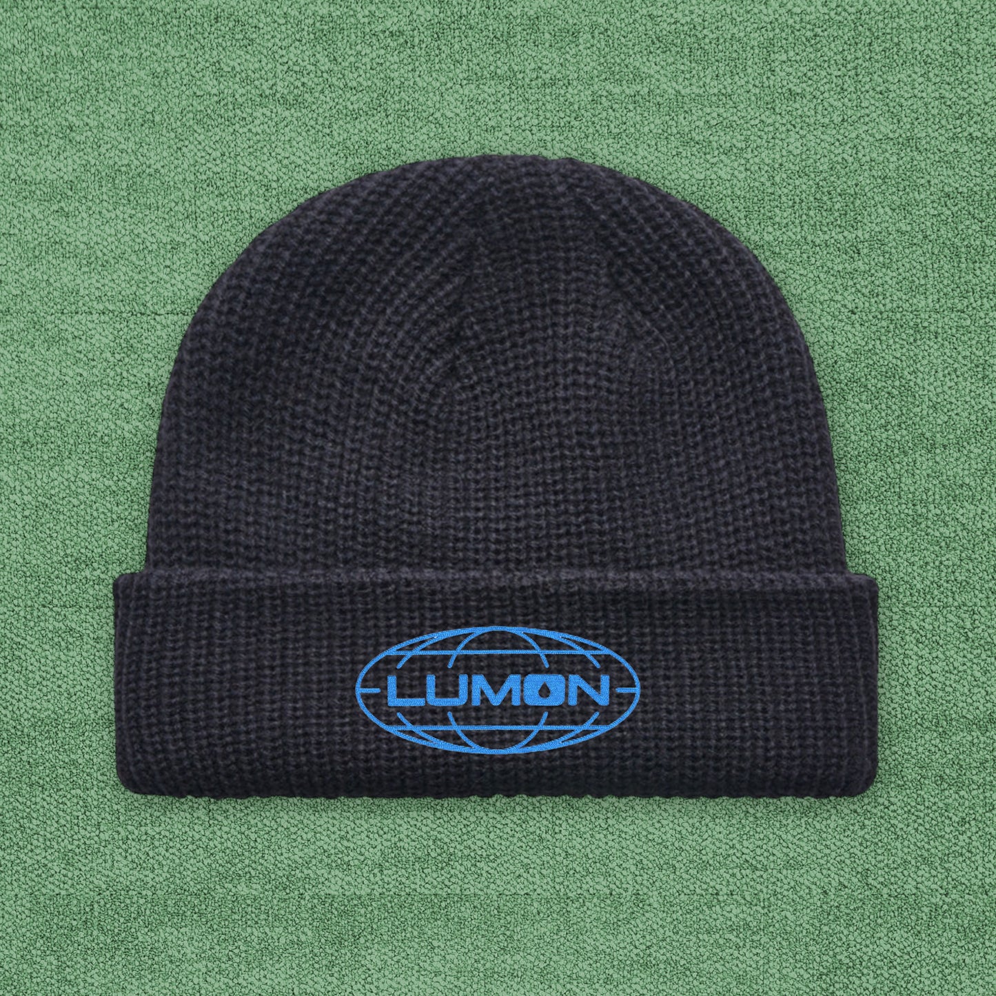 Fisherman-style AS Colour cuff beanie with embroidered blue Lumon Industries logo from Severance, ribbed knit hat.
