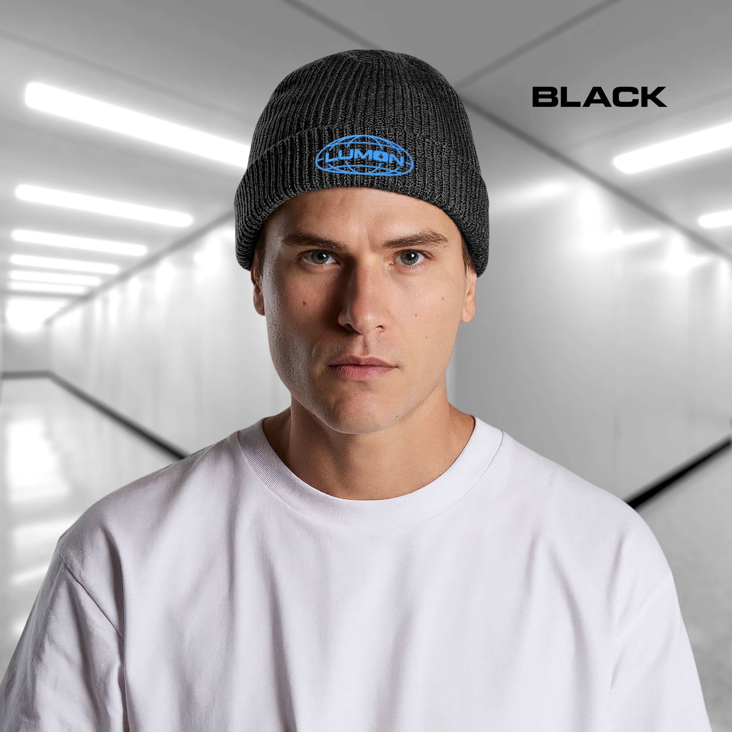Man wearing a Black AS Colour cuff beanie with embroidered blue Lumon Industries logo from Severance, fisherman-style ribbed knit hat.