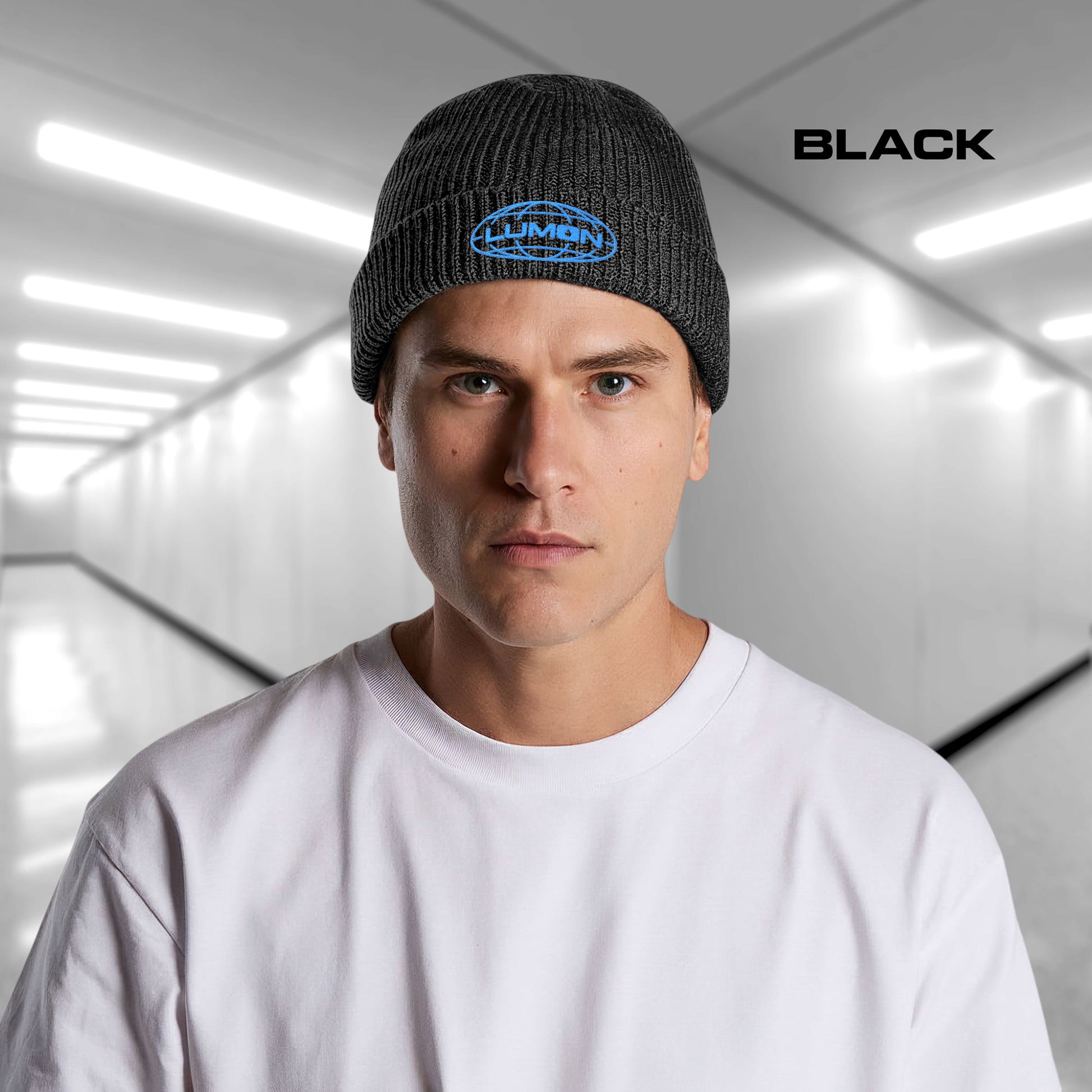 Man wearing a Black AS Colour cuff beanie with embroidered blue Lumon Industries logo from Severance, fisherman-style ribbed knit hat.