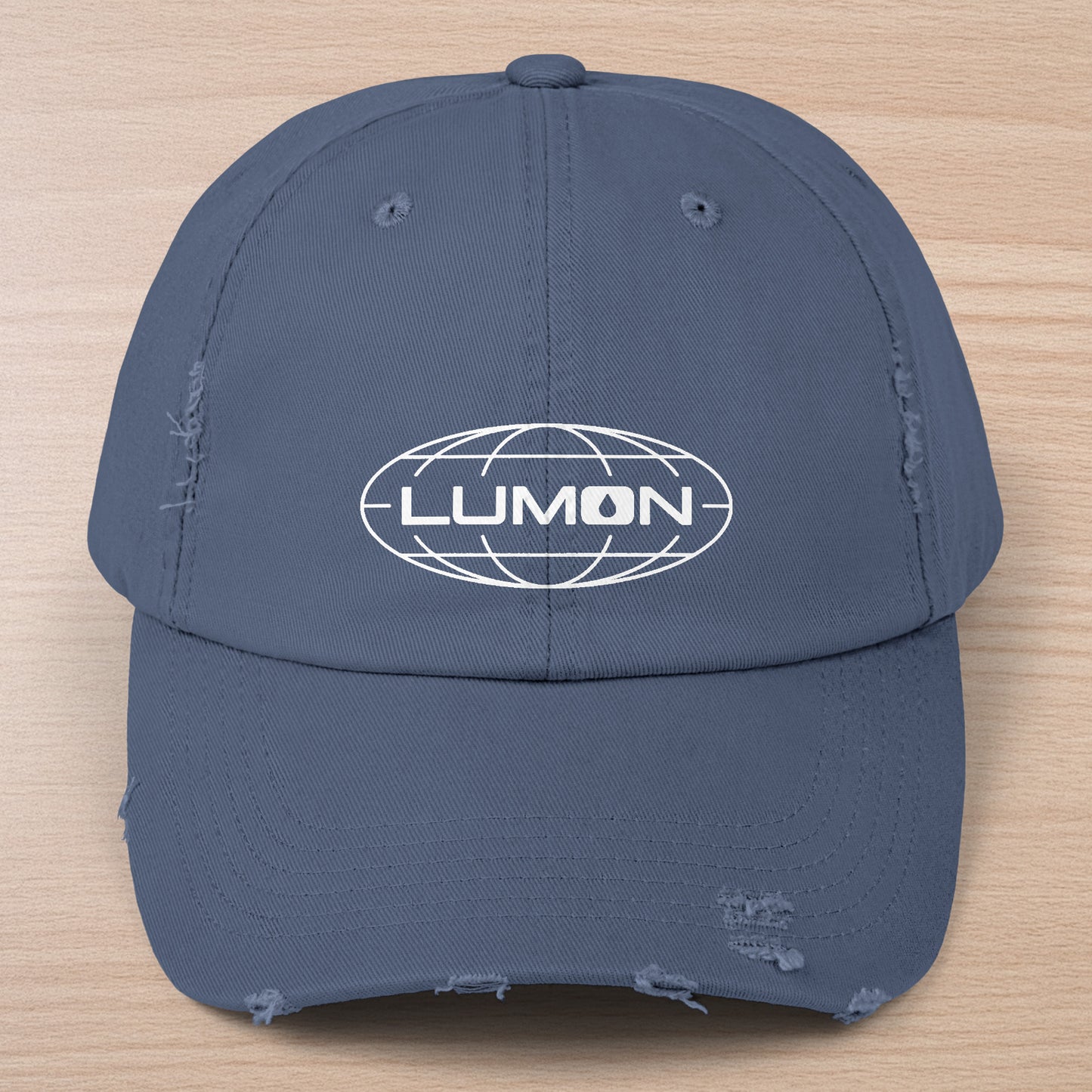 Scotland blue District DT600 Vintage Distressed Baseball Cap with the Lumon Industries logo from the show Severance.