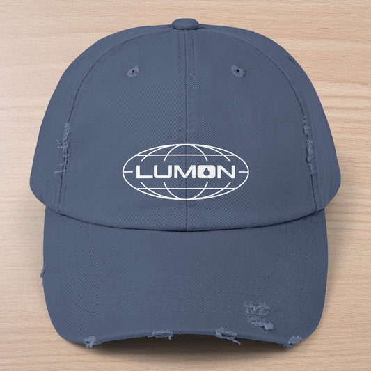 Scotland blue District DT600 Vintage Distressed Baseball Cap with the Lumon Industries logo from the show Severance.