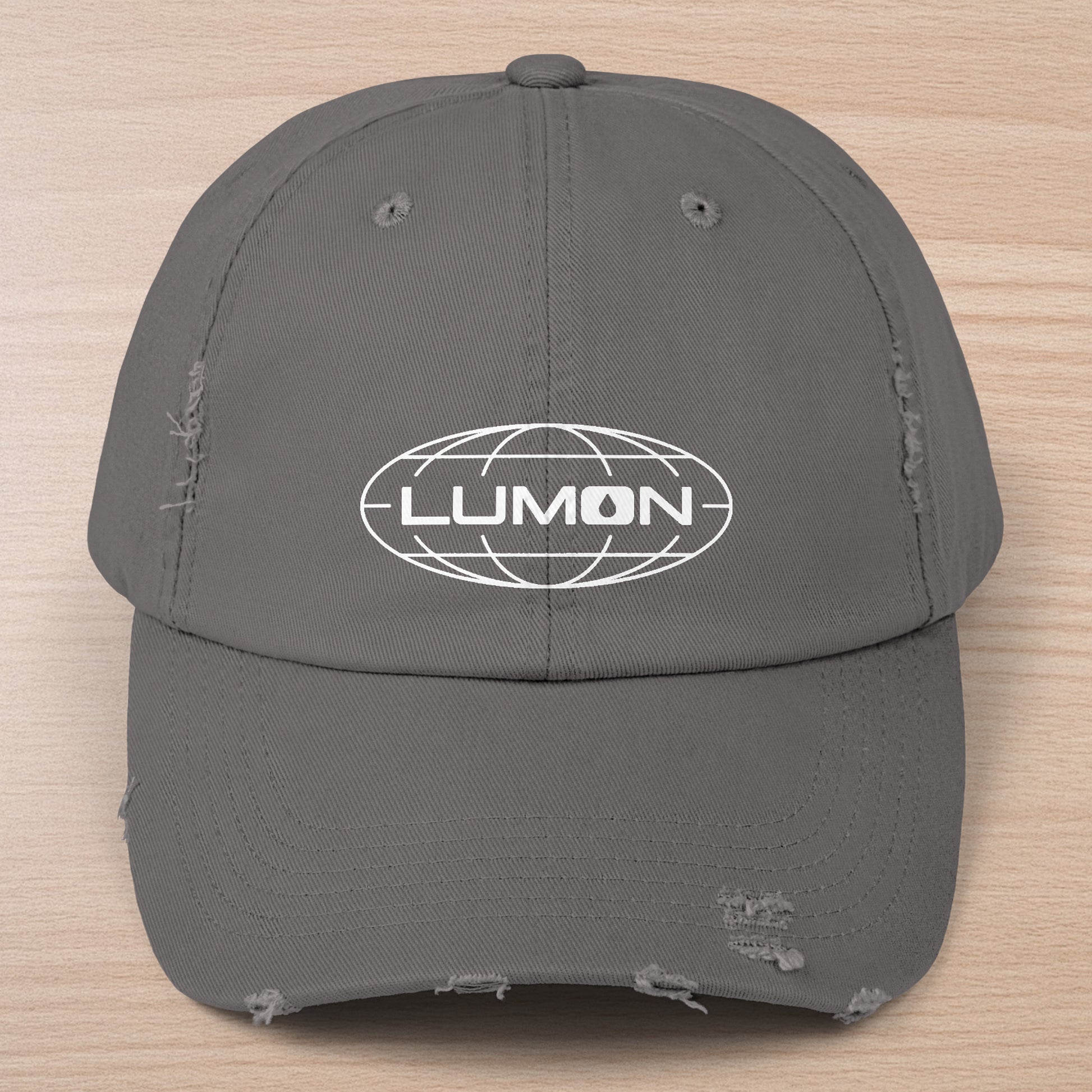 Nickel gray District DT600 Vintage Distressed Baseball Cap with the Lumon Industries logo from the show Severance.