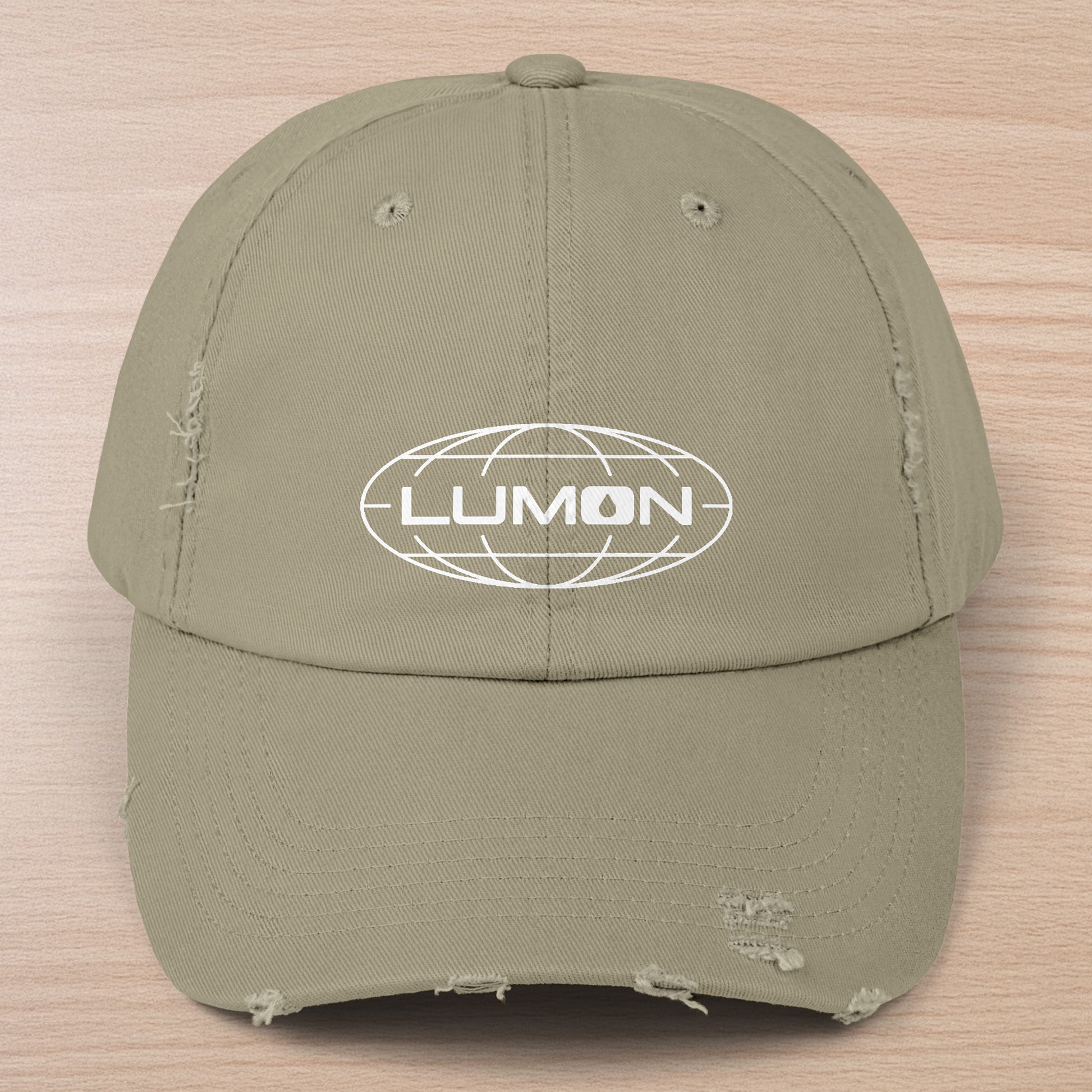 Light Olive District DT600 Vintage Distressed Baseball Cap with the Lumon Industries logo from the show Severance.