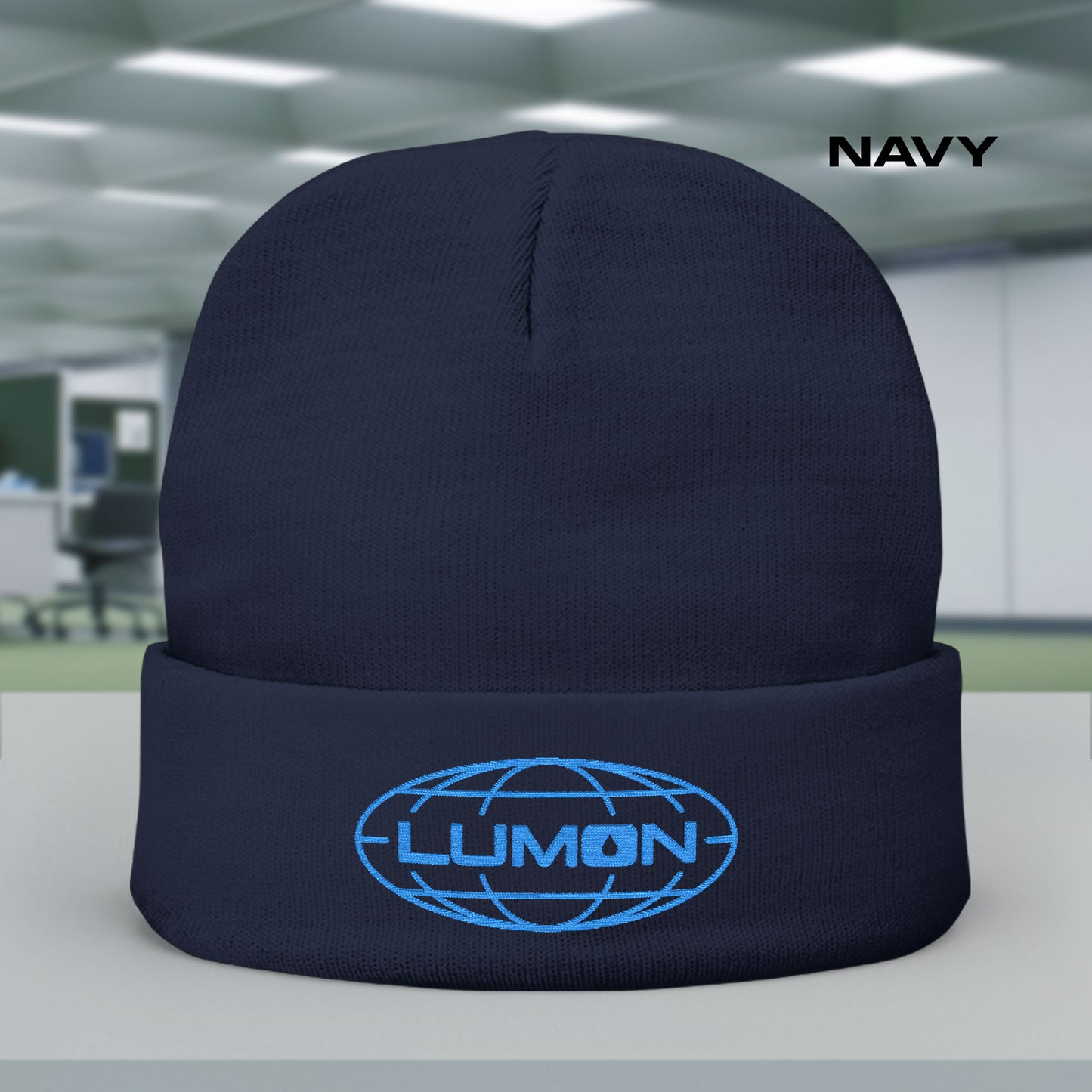 Navy knit beanie with embroidered blue Lumon Industries logo from Apple TV’s Severance.