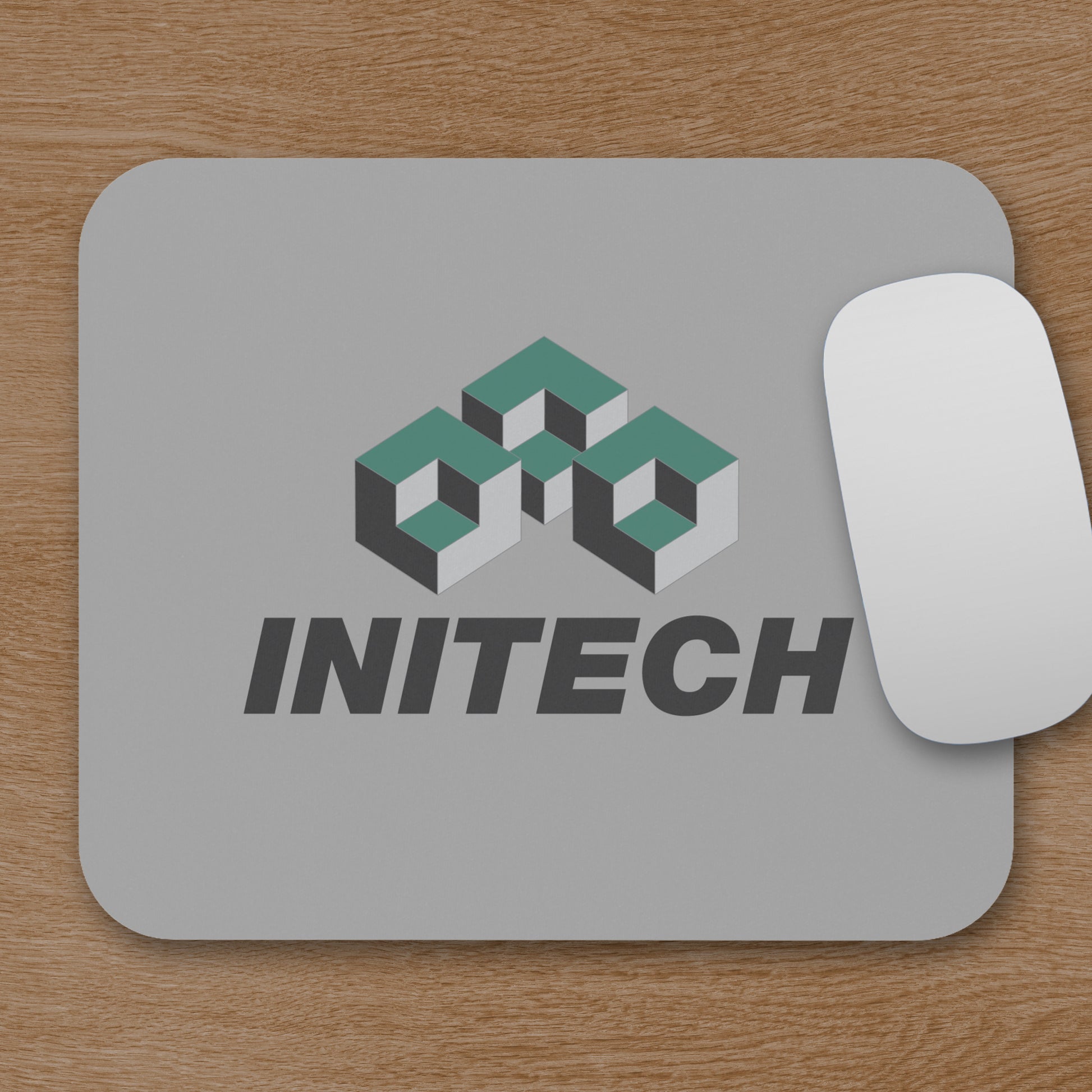Office Space Initech logo mouse pad on desk, shown with a mouse
