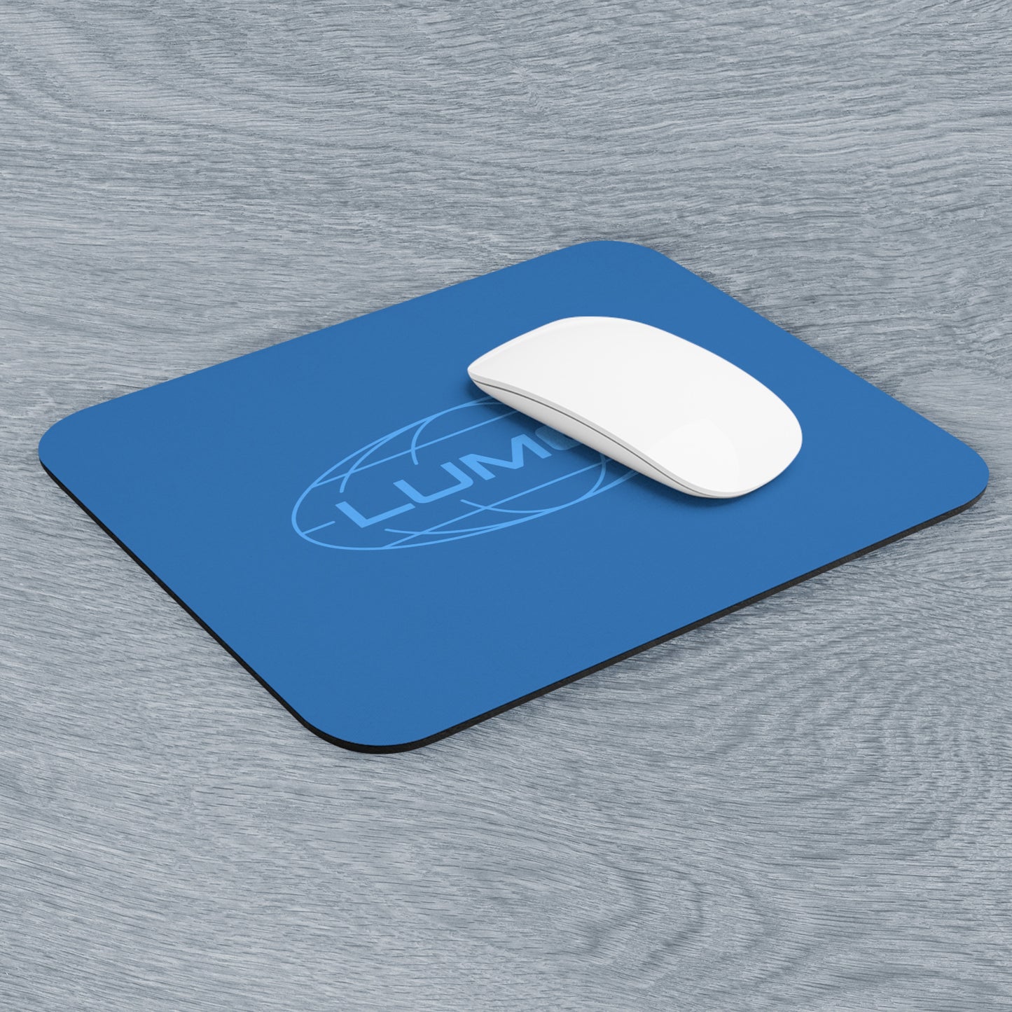 Angled view of a 9x8 modern blue Mouse pad with the Lumon Industries logo from the TV show Severance.