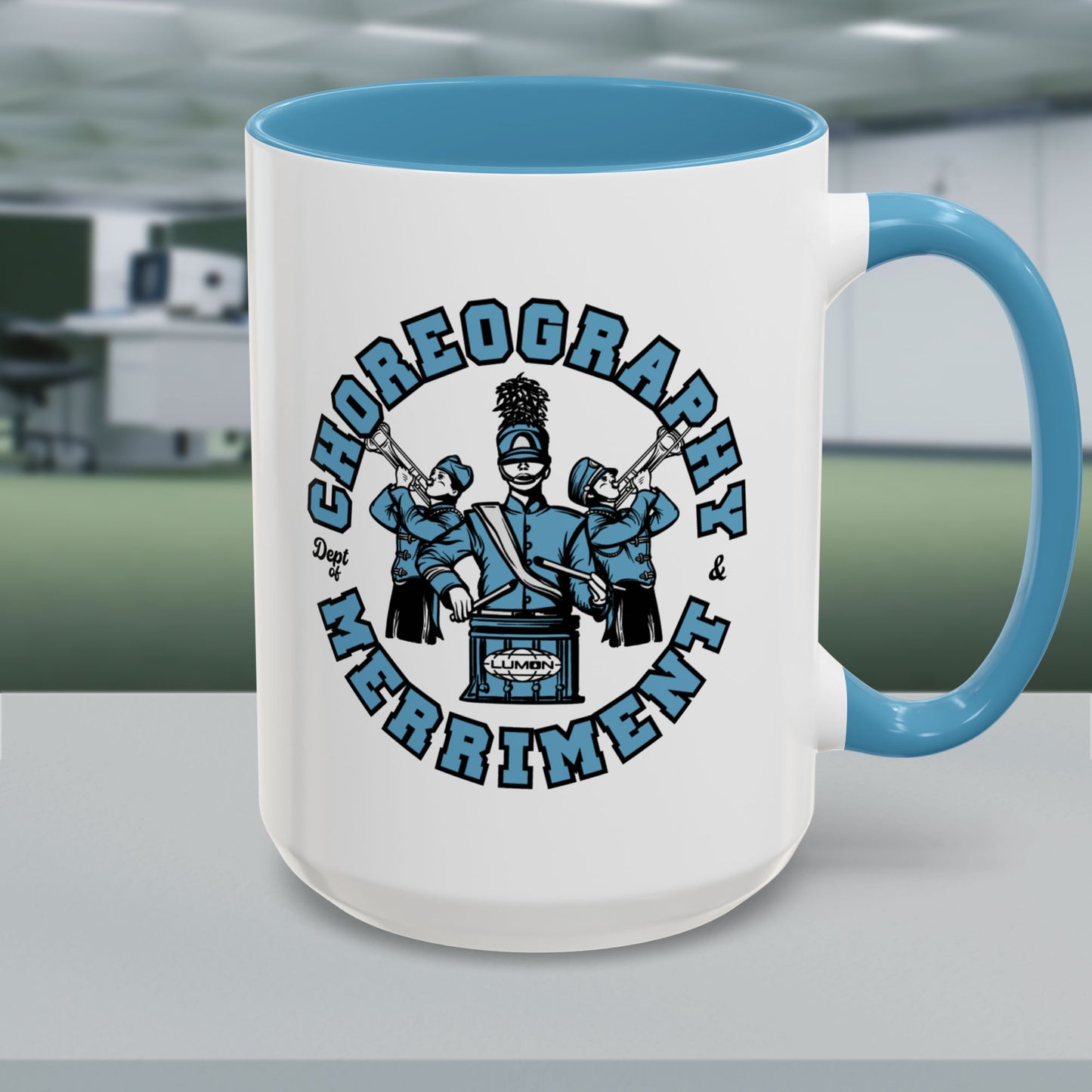 15 oz White ceramic accent mug with blue handle featuring Severance Dept. of Choreography & Merriment graphic.