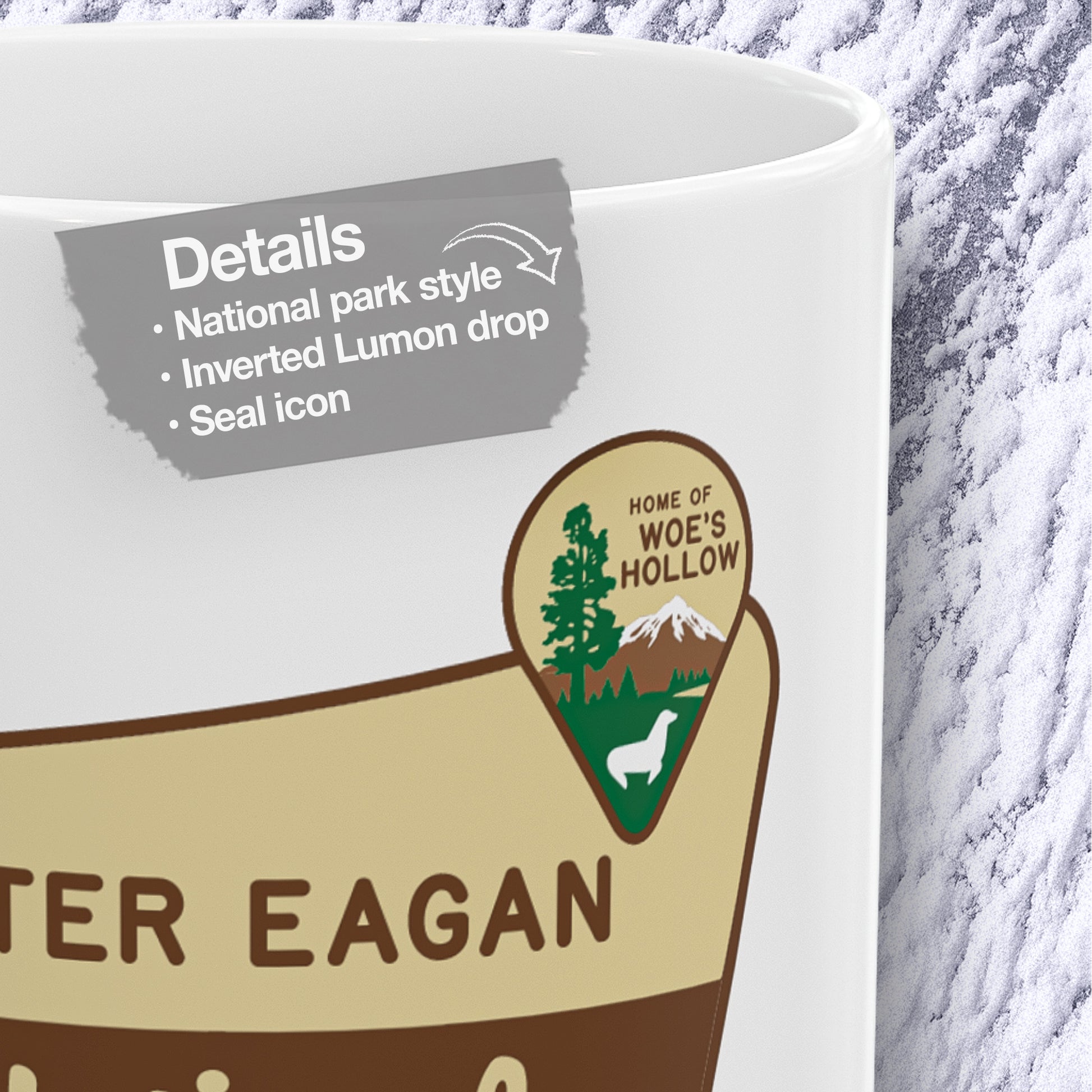 Detail closeup of White ceramic mug with Dieter Eagan National Forest logo, inspired by Woe’s Hollow episode in Severance.