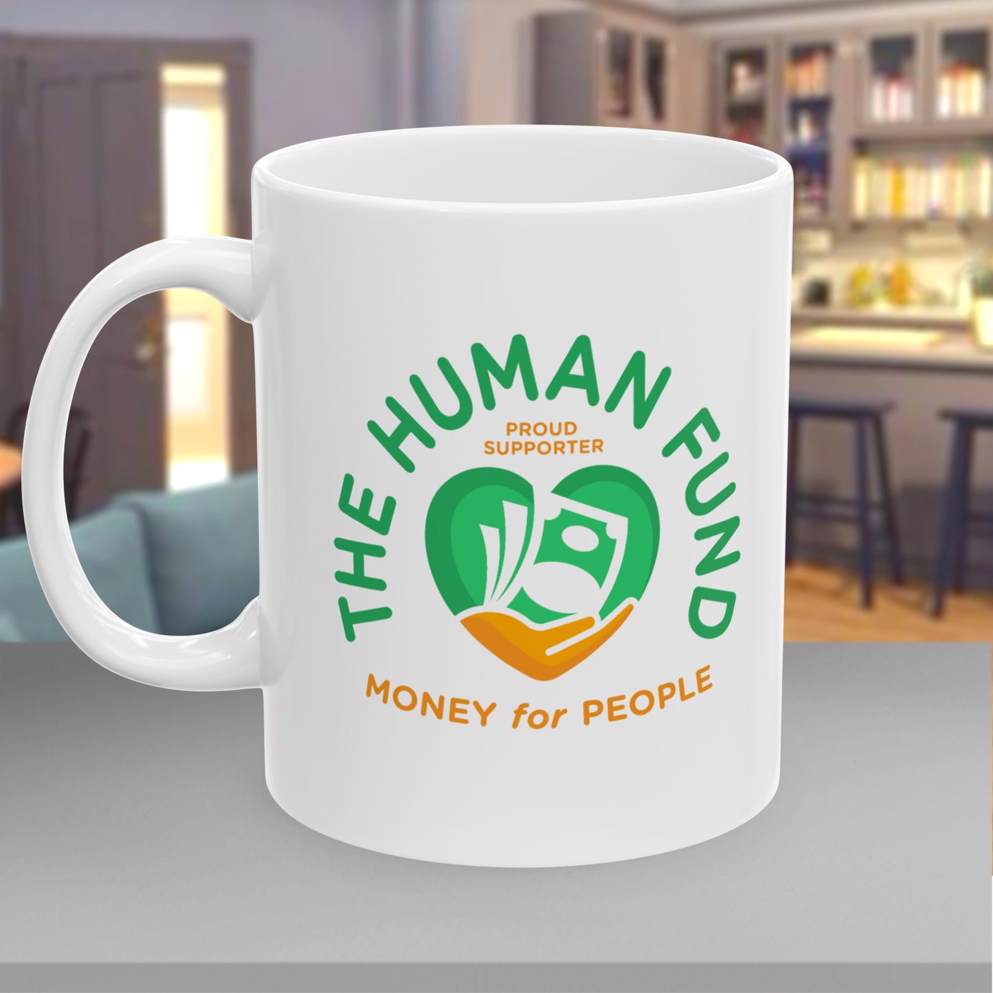White mug with 'The Human Fund' logo and text in a kitchen setting