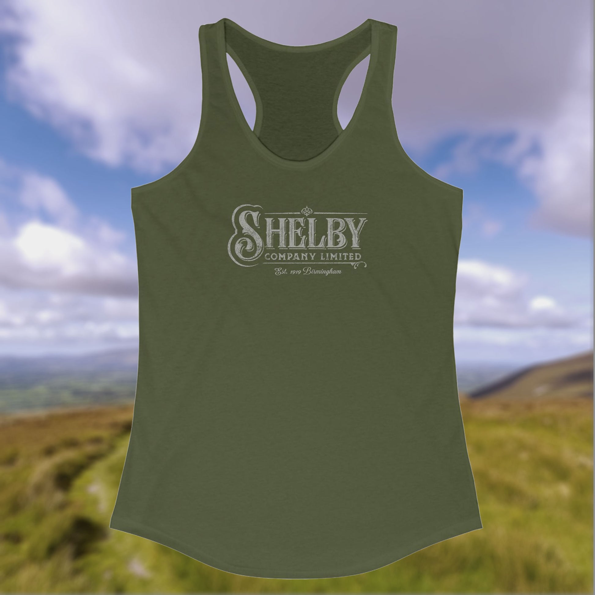 Front view of a military green colored Women's Racerback Tank Top Shirt (Next Level 1533) featuring the Shelby Company LTD logo from the show Peaky Blinders in a vintage distressed style, sold by ScriptedBrand.
