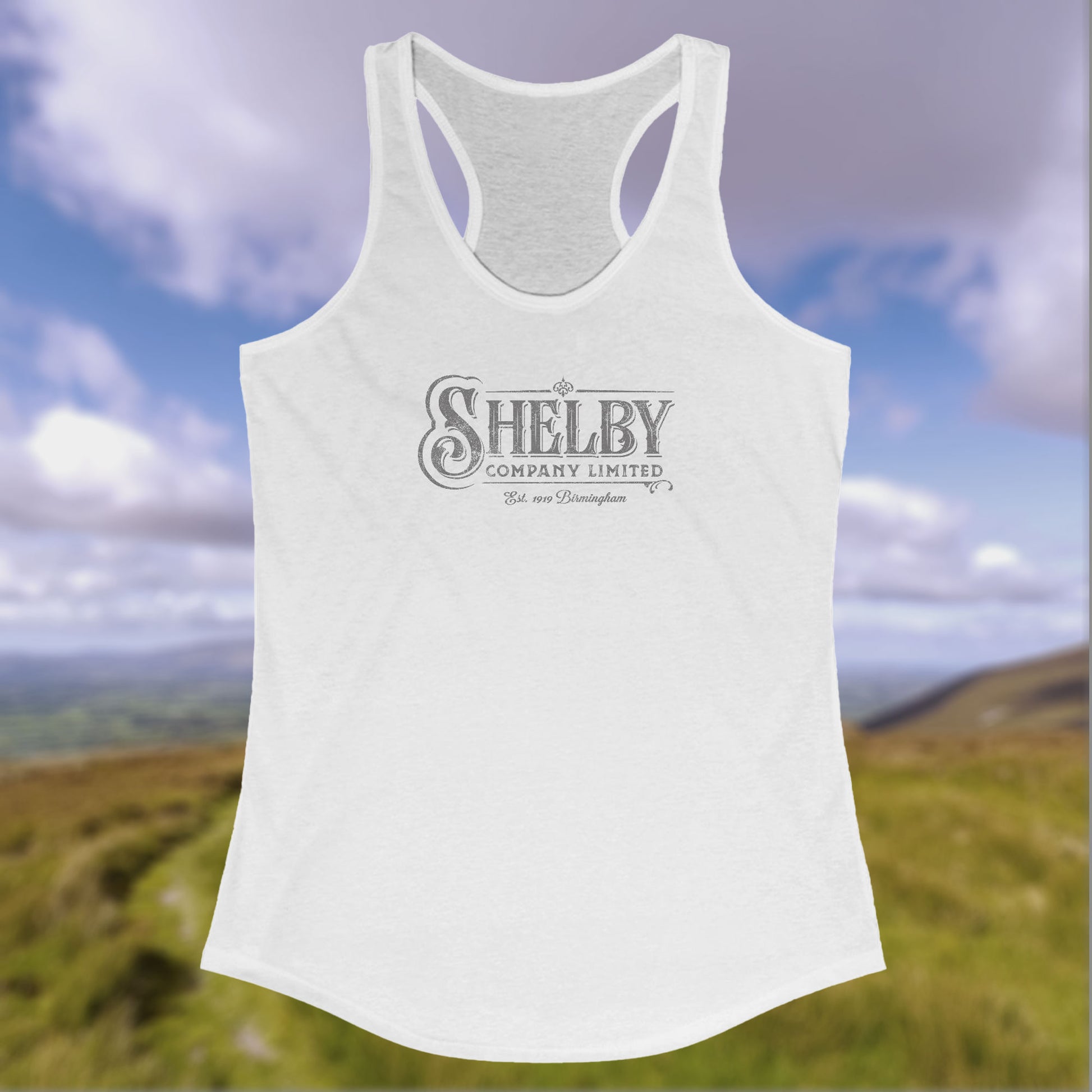 Front view of a white colored Women's Racerback Tank Top Shirt (Next Level 1533) featuring the Shelby Company LTD logo from the show Peaky Blinders in a vintage distressed style, sold by ScriptedBrand.