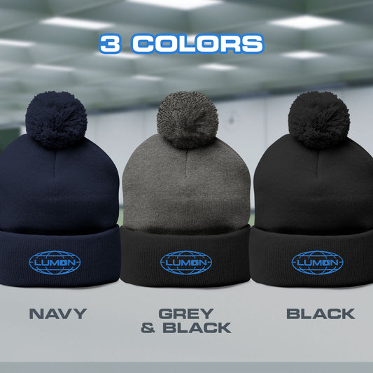 Group of 3 Pom-Pom Winter Knit Hats featuring the embroidered blue logo of Lumon Industries from the Apple TV Show Severance. Colors are Navy Bue, Gray, and Black
