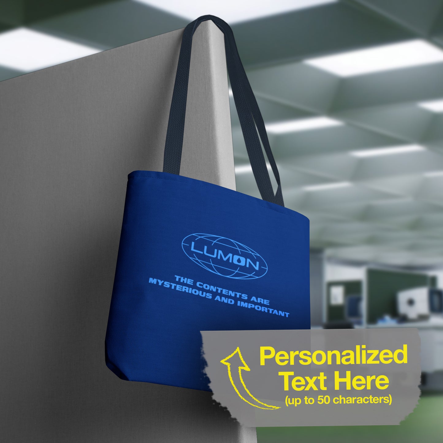 Hanging Blue Tote Bag featuring the logo of Lumon Industries from the Apple TV Show Severance, along with added customizable text by the customer, which is "THE CONTENTS ARE MYSTERIOUS AND IMPORTANT."