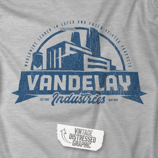 Closeup view of an Athletic Heather Grey Soft Bella+Canvas 3001 short-sleeve t-shirt tee featuring a Vandelay Industries logo graphic, uniquely designed by ScriptedBrand in a vintage distressed style. The fictional company is part of the George Costanza storyline in the TV show Seinfeld. 