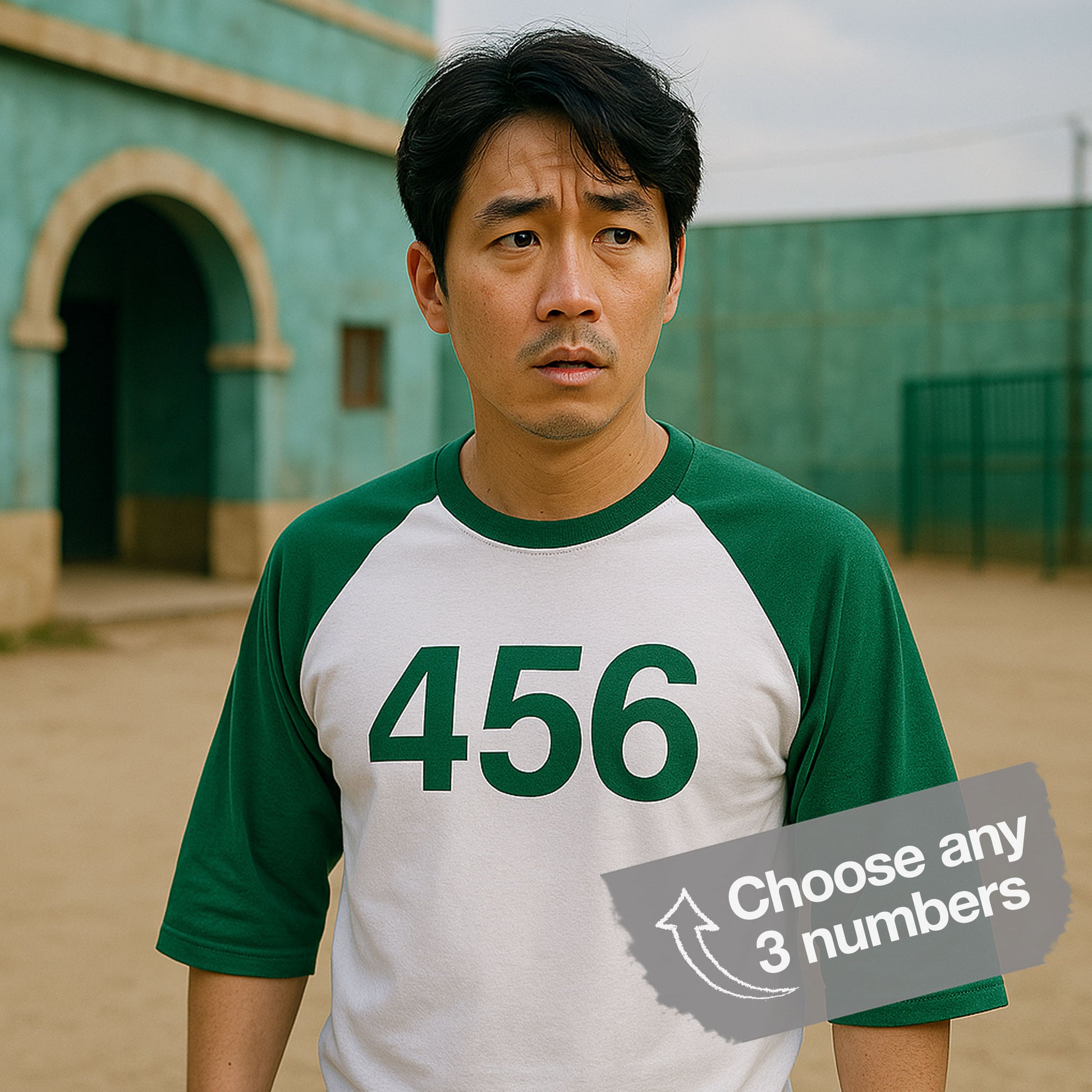 A worried Male player wearing a Green and White colored soft Tultex 245 Unisex Three-Quarter Sleeve Raglan Player T-Shirt featuring the numerals 456 from the popular TV series Squid Game. The shirt can be personalized by the customer to include any three digits.