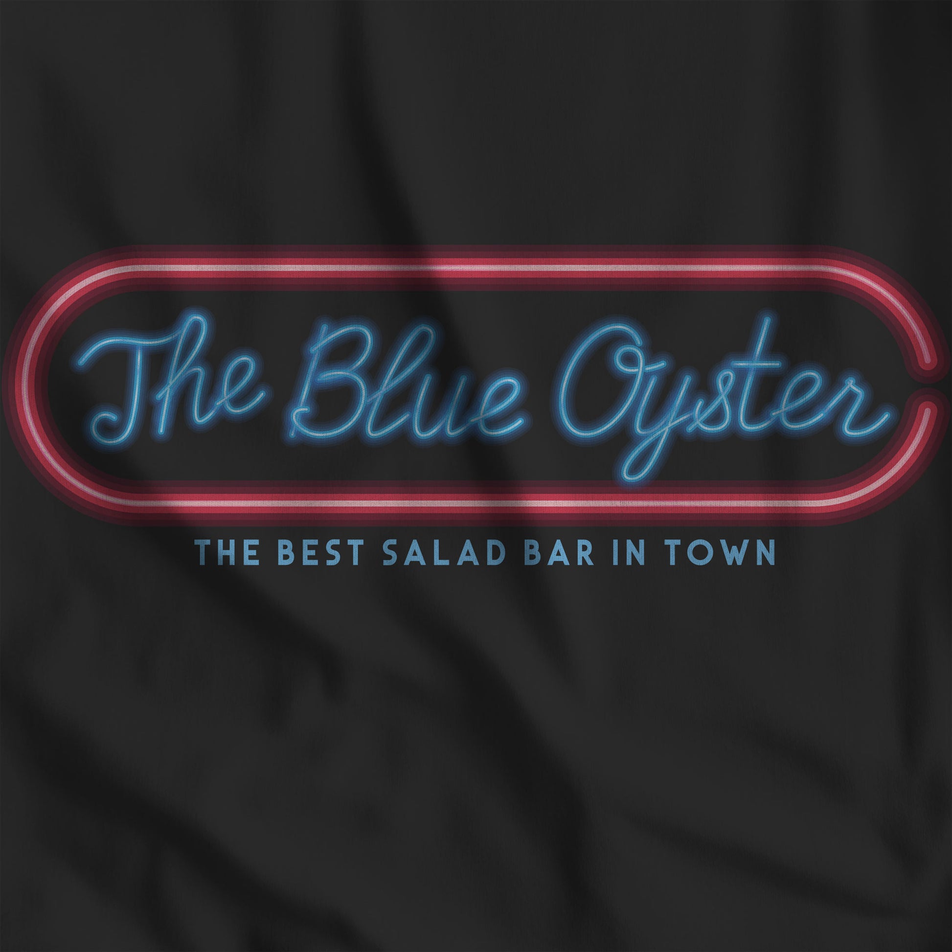 Closeup of Black colored graphic t-shirt with The Blue Oyster Bar neon sign inspired by Police Academy, soft Bella+Canvas cotton 80s movie tee