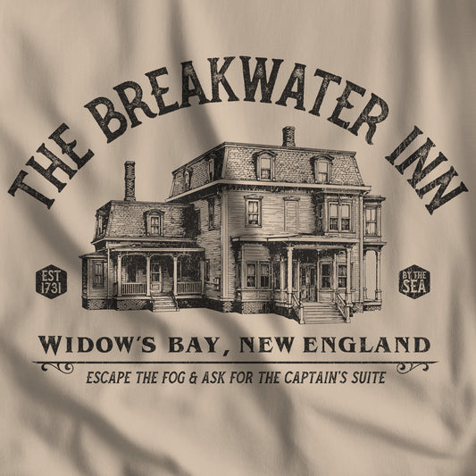 Closeup of 'The Breakwater Inn' vintage illustrated t-shirt inspired by Widow's Bay Apple TV series, soft Bella+Canvas cotton fan tee
