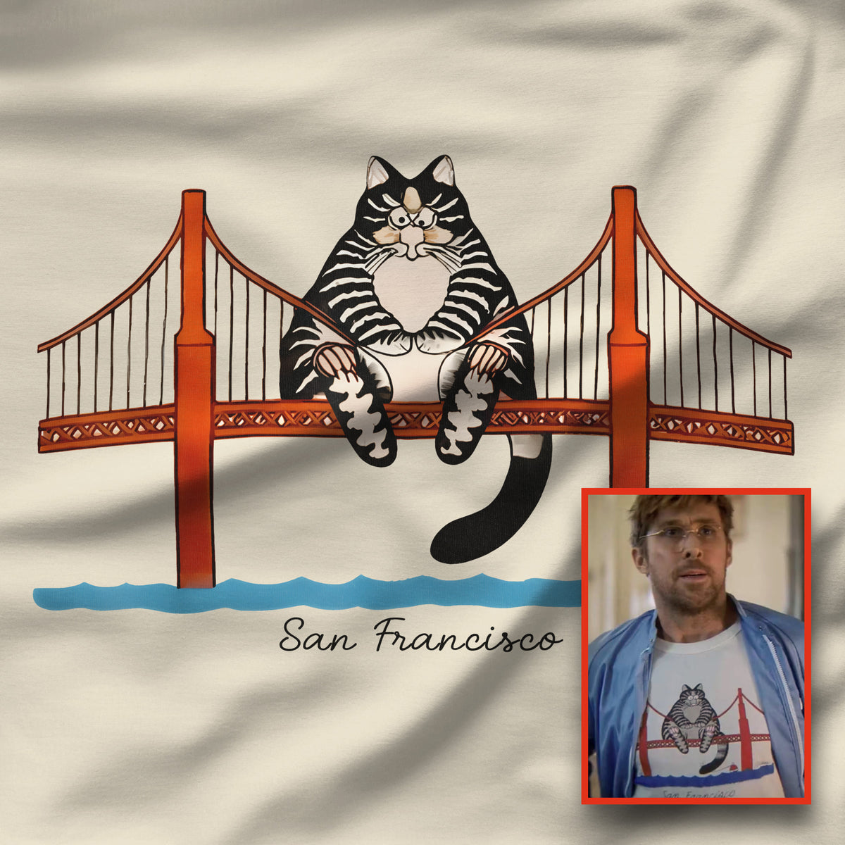 Closeup of natural cream tee with illustrated tabby cat sitting on the Golden Gate Bridge, San Francisco, Project Hail Mary