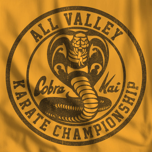 Closeup of Gold Cobra Kai All Valley Karate Championship vintage distressed graphic t-shirt, soft Bella+Canvas cotton Karate Kid tee