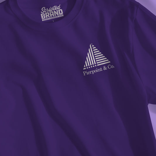 Closeup of purple Pierpoint & Co. corner logo t-shirt inspired by HBO Industry TV series, soft Bella+Canvas cotton investment bank fan tee