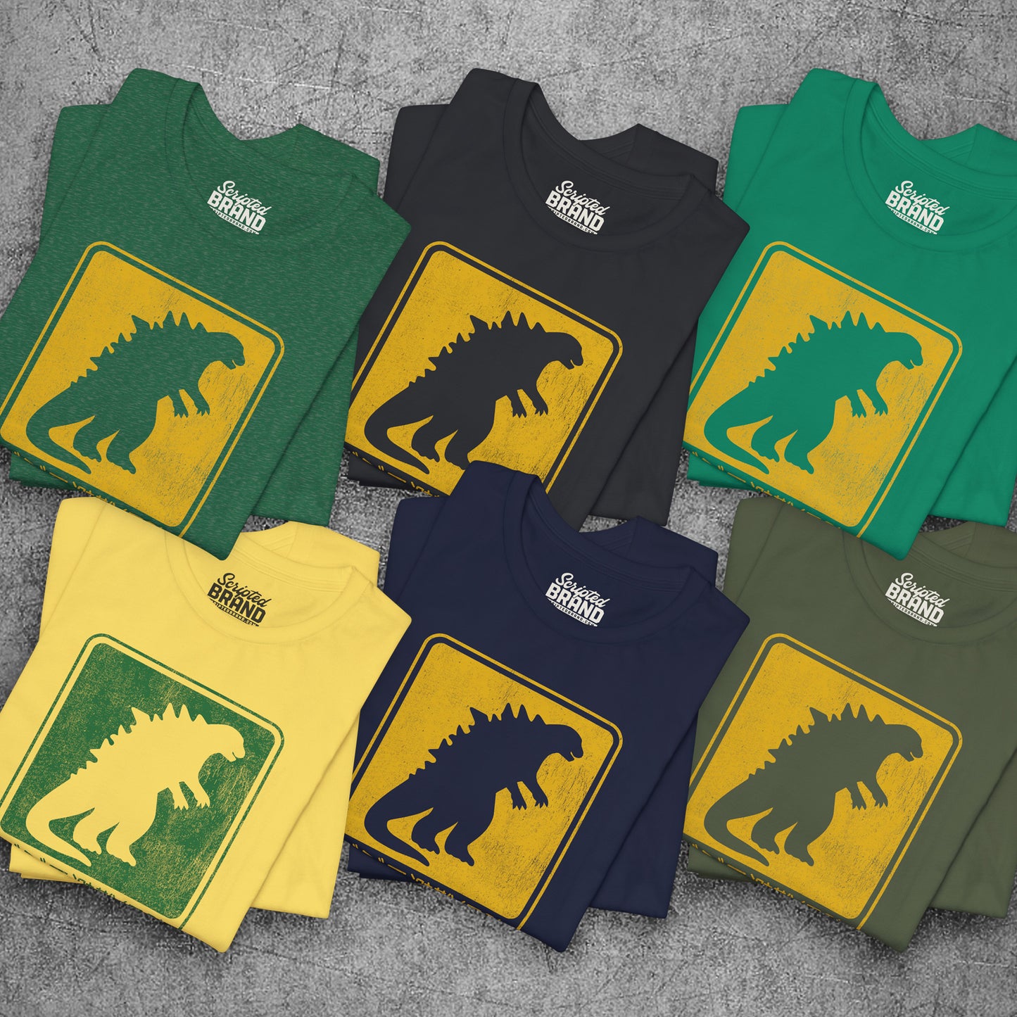 Six folded Godzilla Evacuation Route distressed graphic t-shirts inspired by Monarch Legacy of Monsters, soft Bella+Canvas tee
