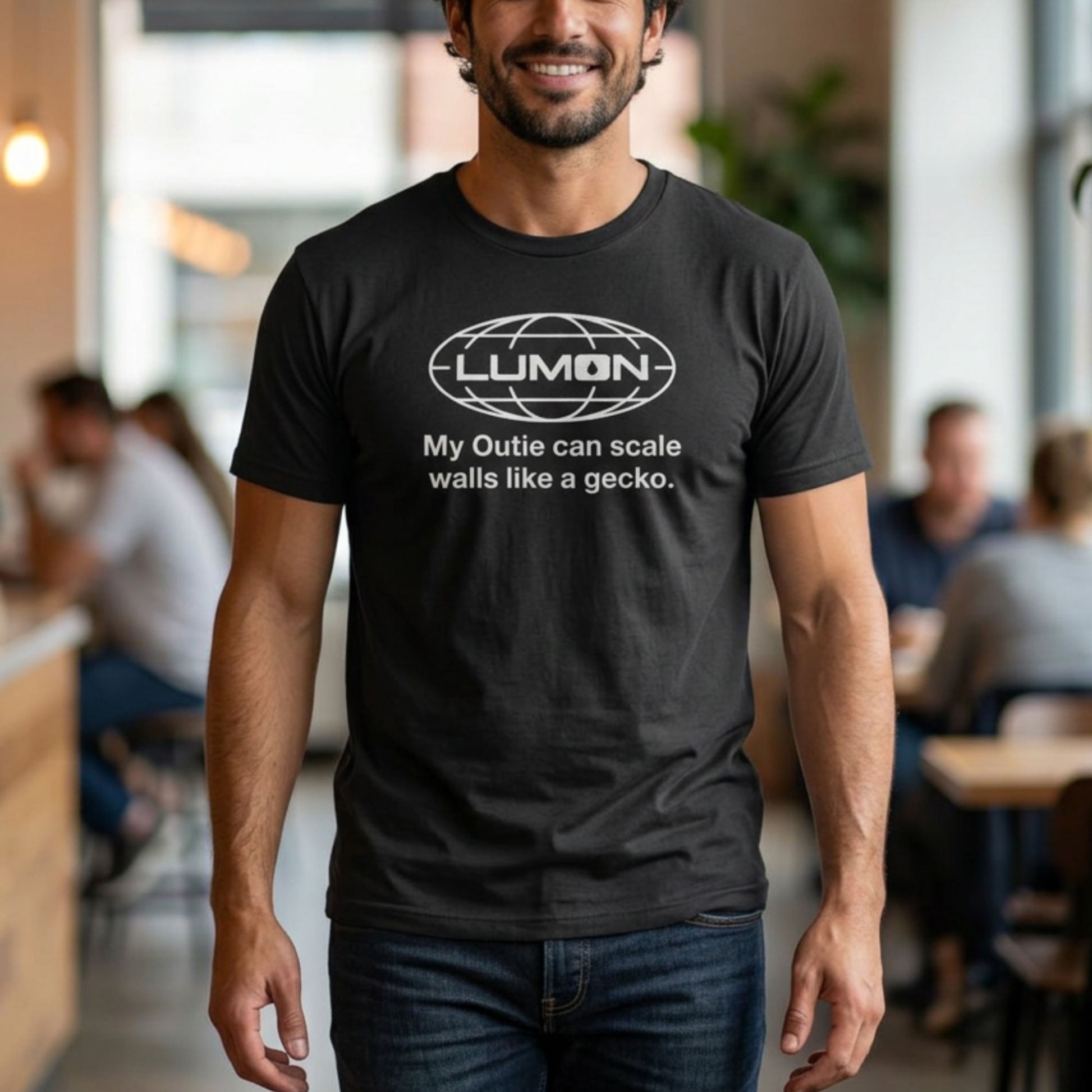 Person wearing Heather black Lumon Industries t-shirt with personalized custom text below logo, Severance fan tee