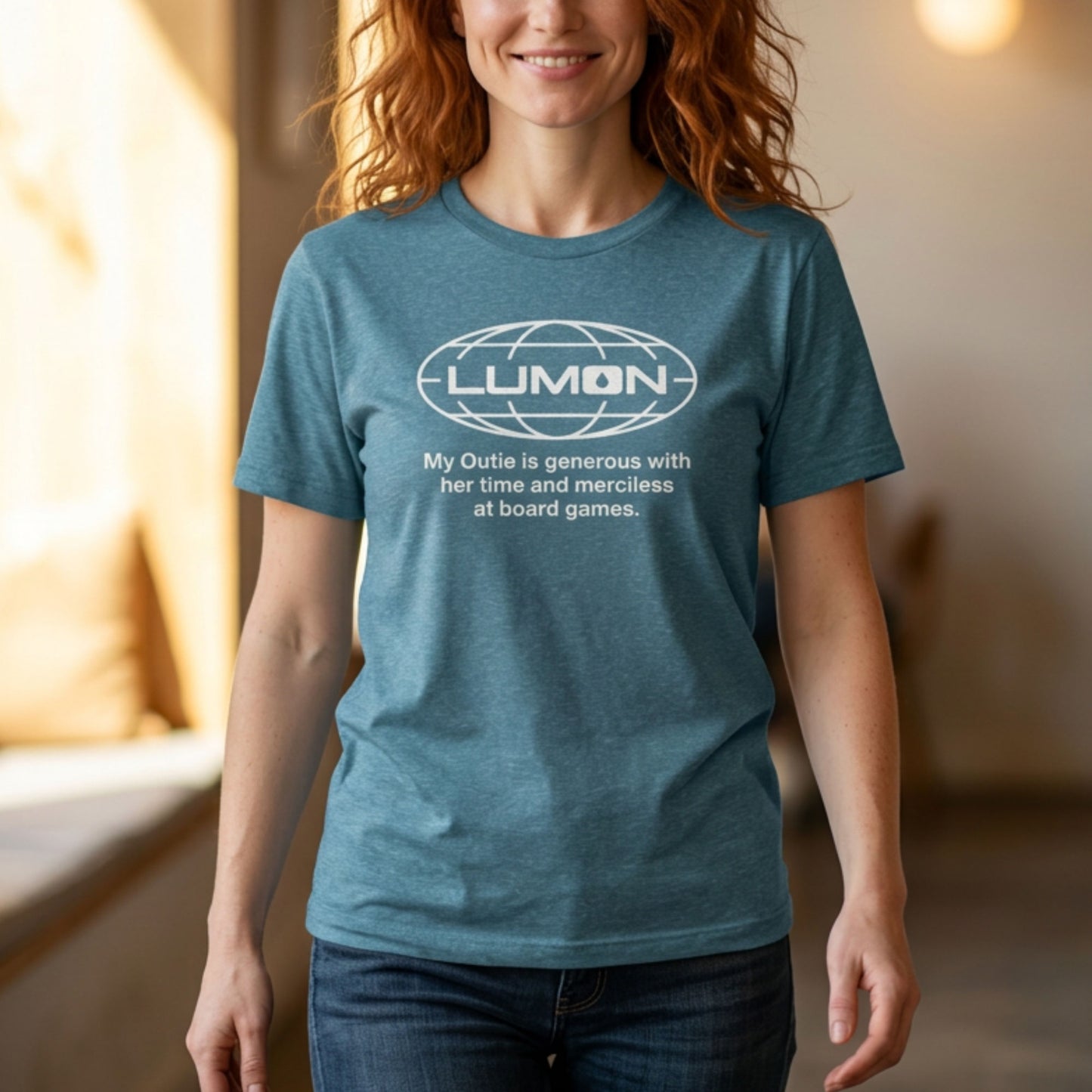 Person wearing Heather teal Lumon Industries t-shirt with personalized custom text below logo, Severance fan tee