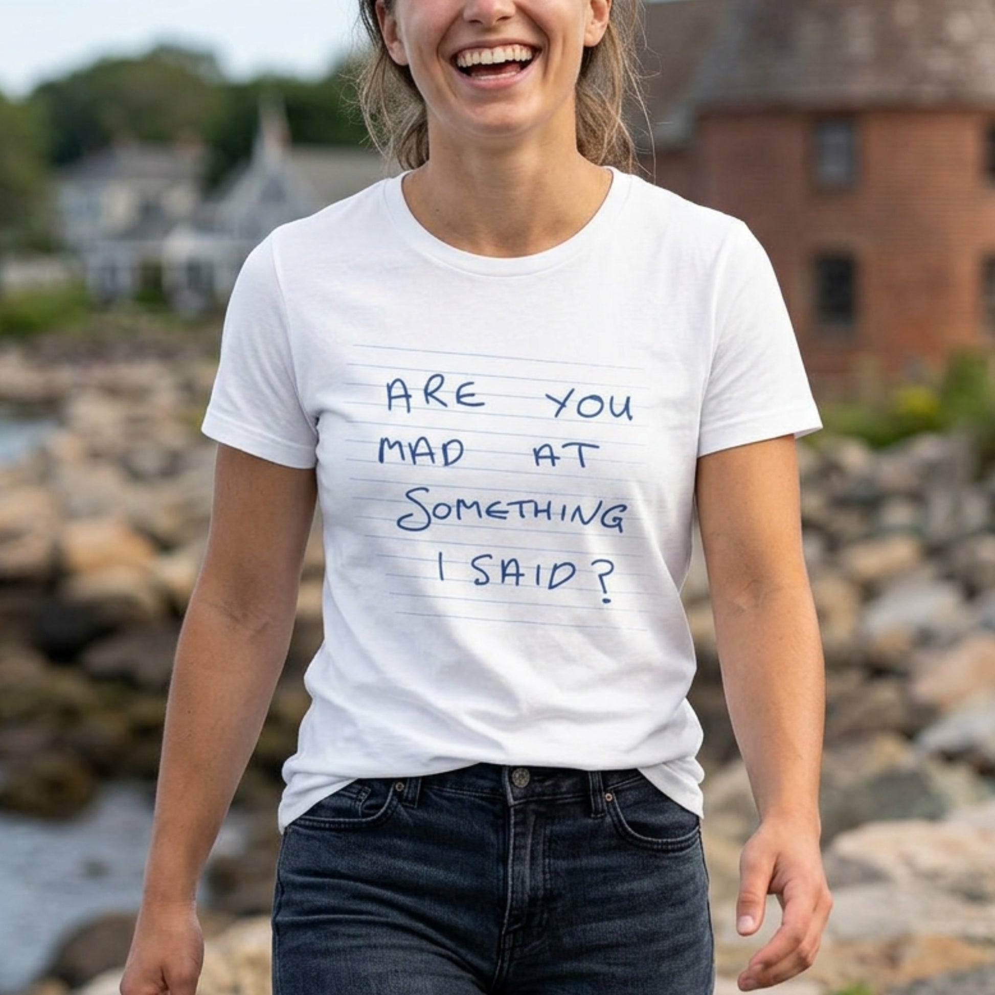 Woman wearing White t-shirt with handwritten Patricia note from Widow's Bay reading "Are You Mad At Something I Said?"