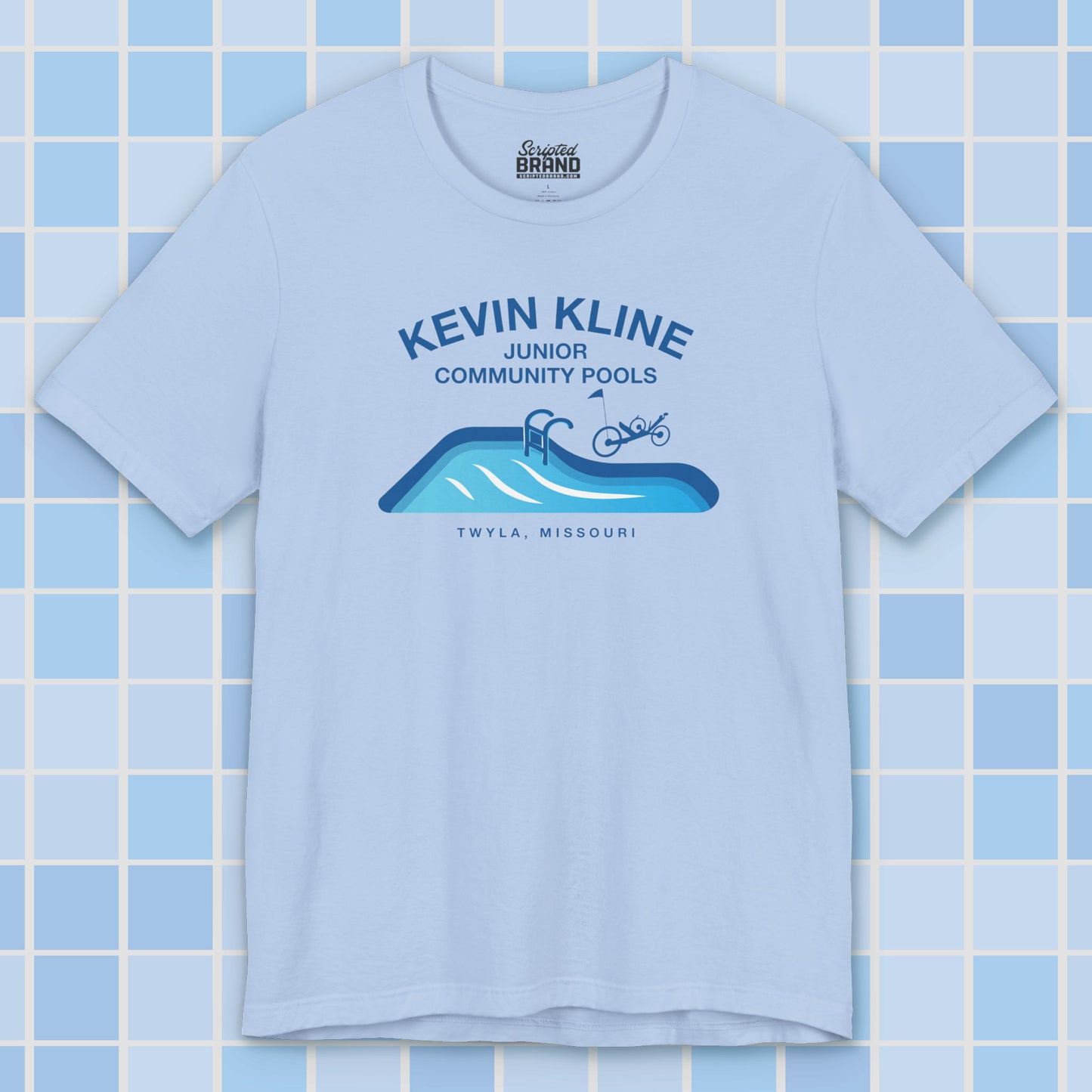 Light blue DTF St. Louis Kevin Kline Junior Community Pools graphic tee with pool and recumbent trike, Bella+Canvas 3001.