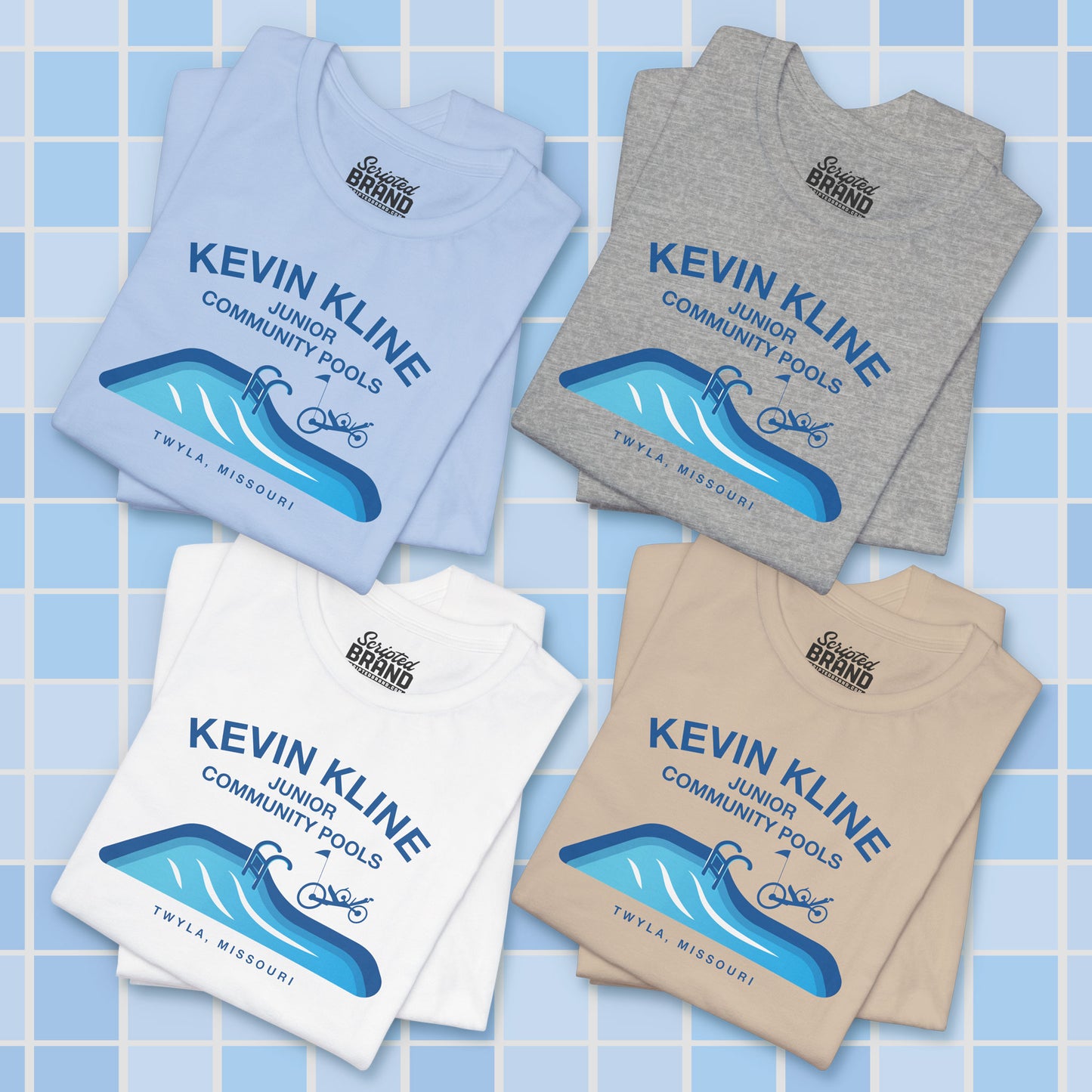 Four folded DTF St. Louis Kevin Kline Junior Community Pools graphic tees with pool and recumbent trike, Bella+Canvas 3001.