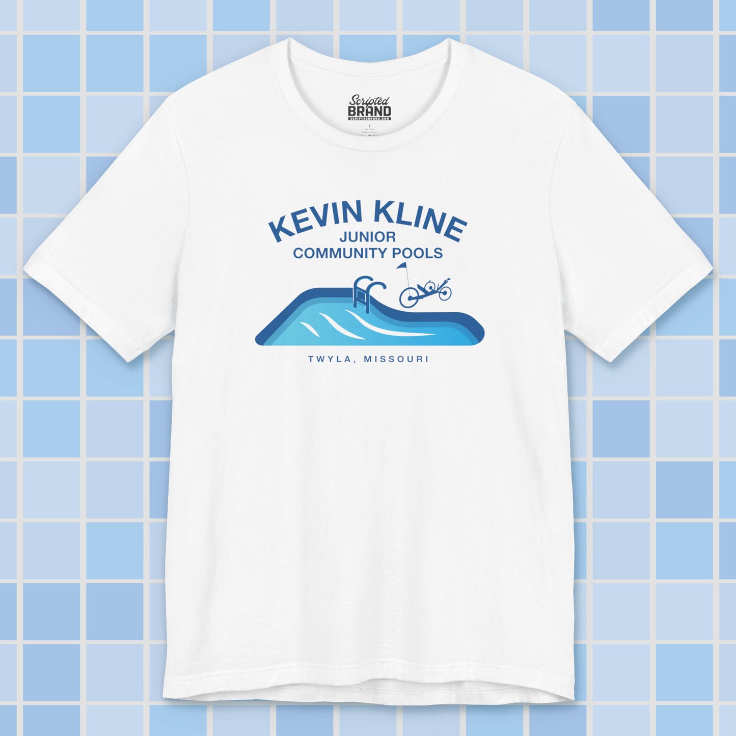 White DTF St. Louis Kevin Kline Junior Community Pools graphic tee with pool and recumbent trike, Bella+Canvas 3001.