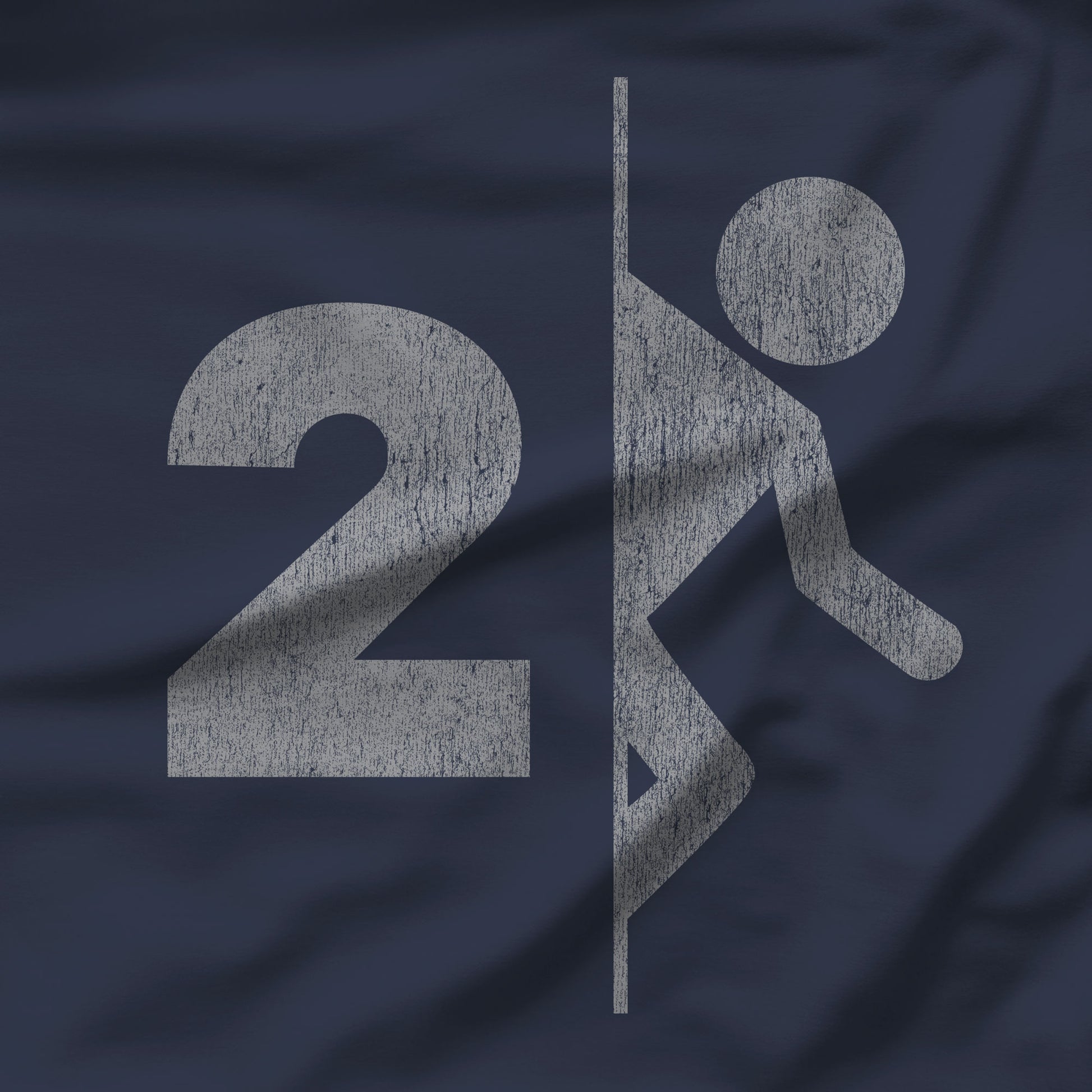 Closeup of Navy tee with vintage distressed Portal 2 partial logo figure diving through a portal, aperture labs