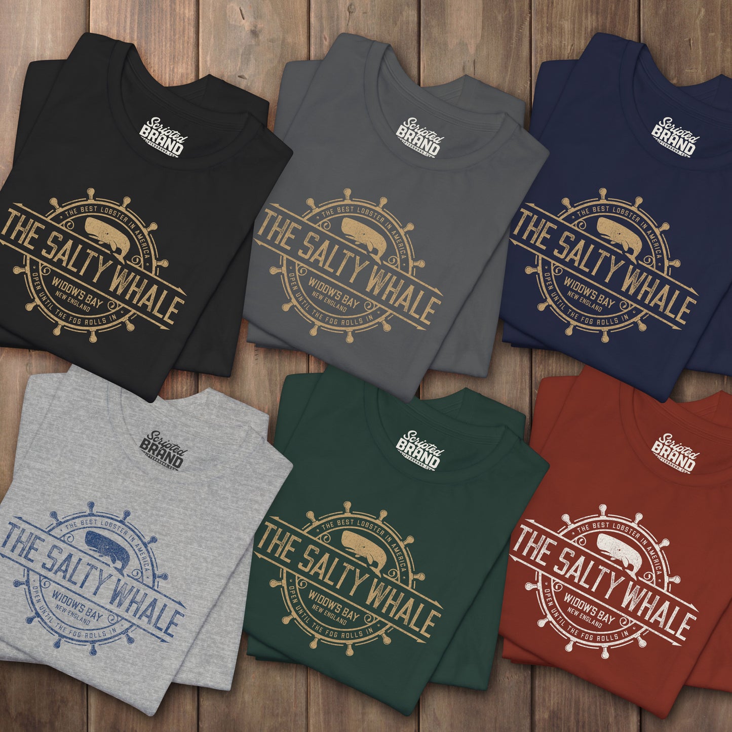 Six folded 'The Salty Whale' vintage distressed pub logo t-shirt inspired by Widow's Bay Apple TV series, soft Bella+Canvas cotton tee