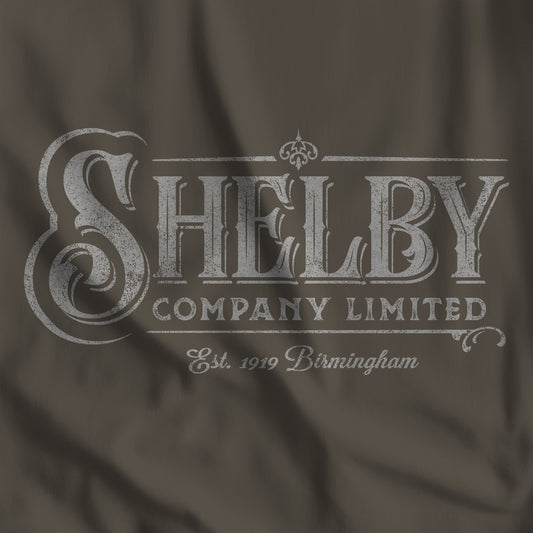 Closeup of army colored Bella+Canvas 3001 t-shirt featuring a vintage Shelby Company Limited logo from Peaky Blinders.