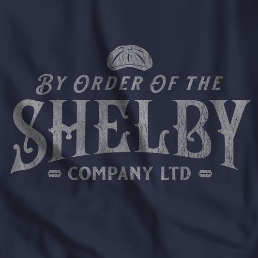 Closeup of Navy blue Bella+Canvas 3001 t-shirt featuring a Shelby Company Limited logo graphic from Peaky Blinders.