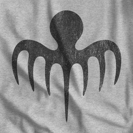 Closeup of heather gray tee with vintage distressed black Spectre octopus emblem James Bond-inspired graphic
