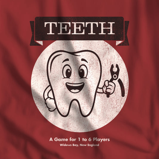 Closeup of Cardinal Red Bella+Canvas tee with the vintage TEETH board game box cover from Widow's Bay, a smiling tooth holding pliers