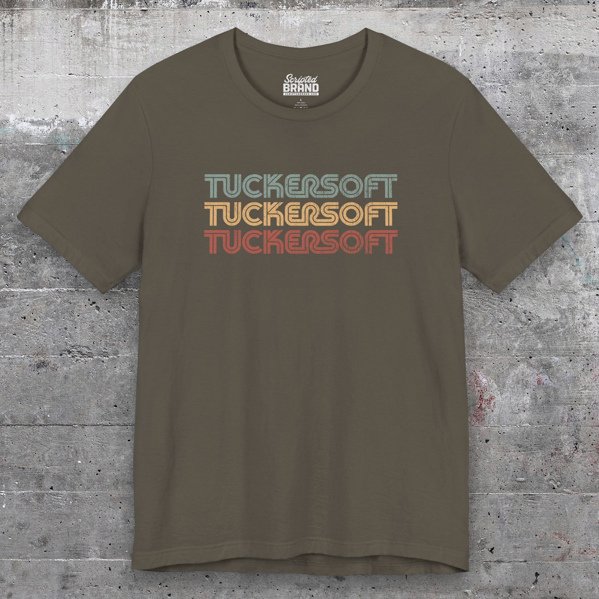 Front view of an army colored soft Bella+Canvas 3001 short-sleeve t-shirt tee featuring a logo graphic of the 1980s fictional video game company Tuckersoft inspired by the TV show Black Mirror and the episode Bandersnatch in a vintage distressed style, sold by ScriptedBrand.