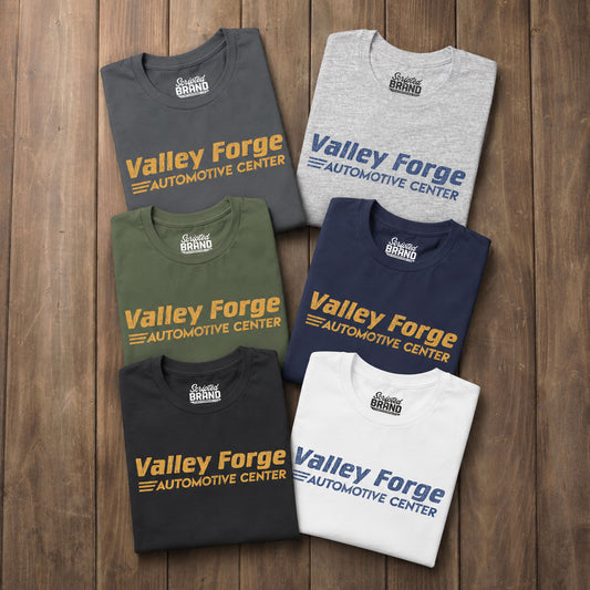 Six folded tees with vintage Valley Forge Automotive Center auto shop logo from comedian Shane Gillis Tires TV show