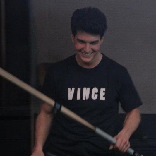Tom Cruise wearing a VINCE shirt in a scene in the movie 'The Color of Money'