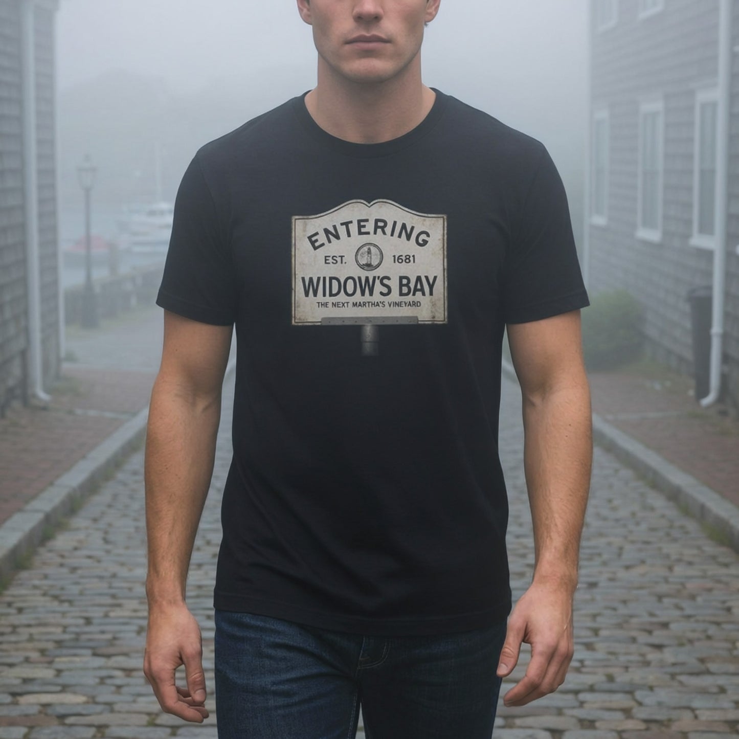 Man wearing black 'Entering Widow's Bay' vintage town sign t-shirt inspired by Apple TV series, soft Bella+Canvas cotton New England tee