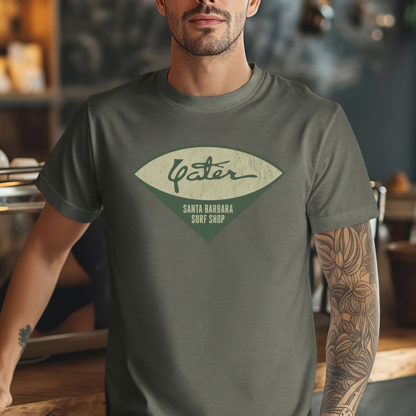Man wearing Yater Surf Shop vintage distressed t-shirt in heather military green, Bella+Canvas 3001, worn by Robert Duvall in Apocalypse Now.