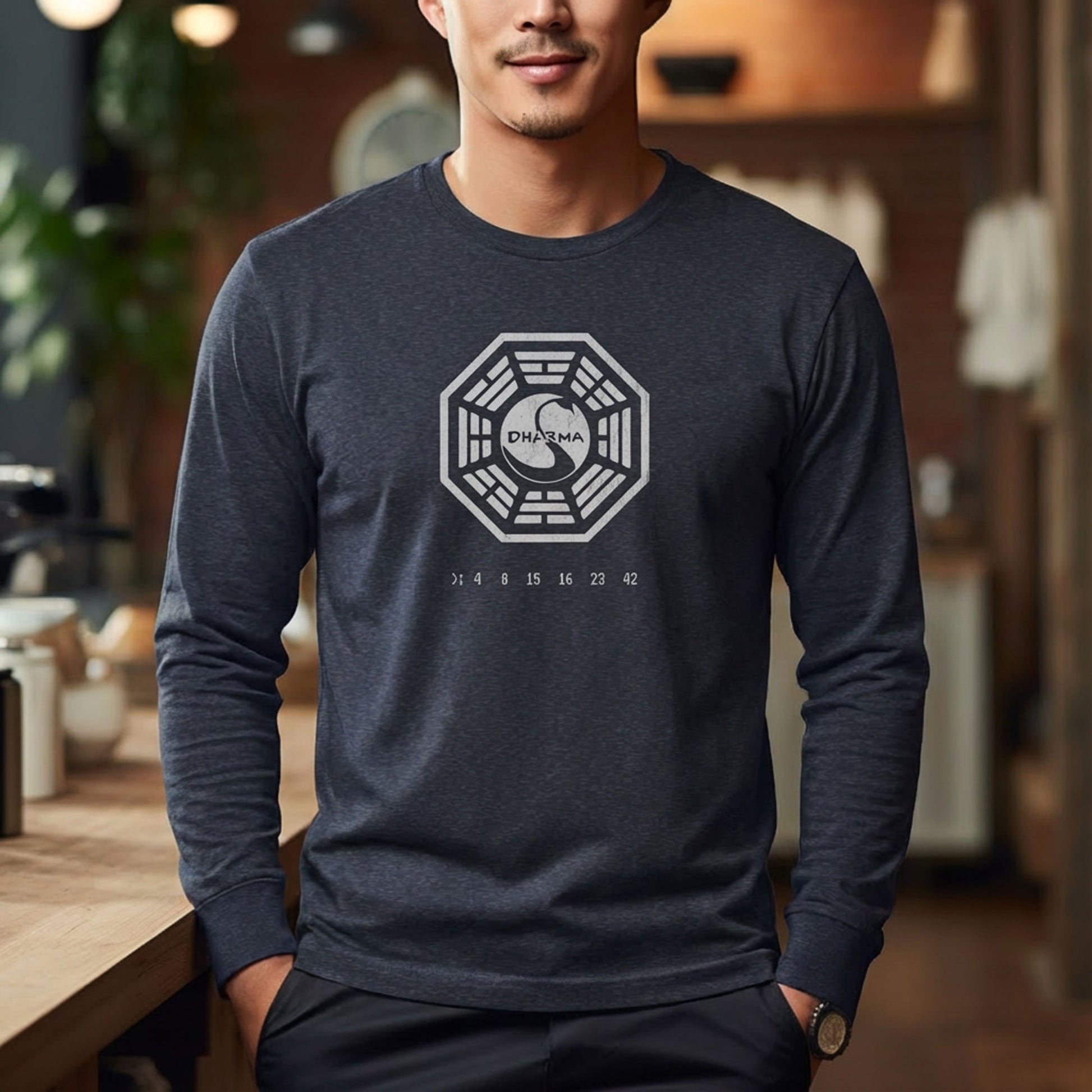 Man wearing Heather Navy blue long sleeve t-shirt with distressed Dharma Initiative Swan Station logo and hatch numbers from LOST
