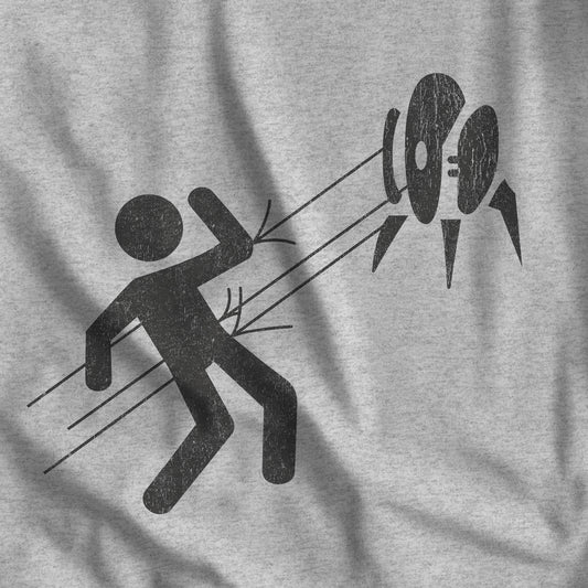 Closeup view of Heather Gray Aperture Science Turret warning icon t-shirt on Bella+Canvas 3001, vintage distressed print, Portal and Portal 2 fan tee.