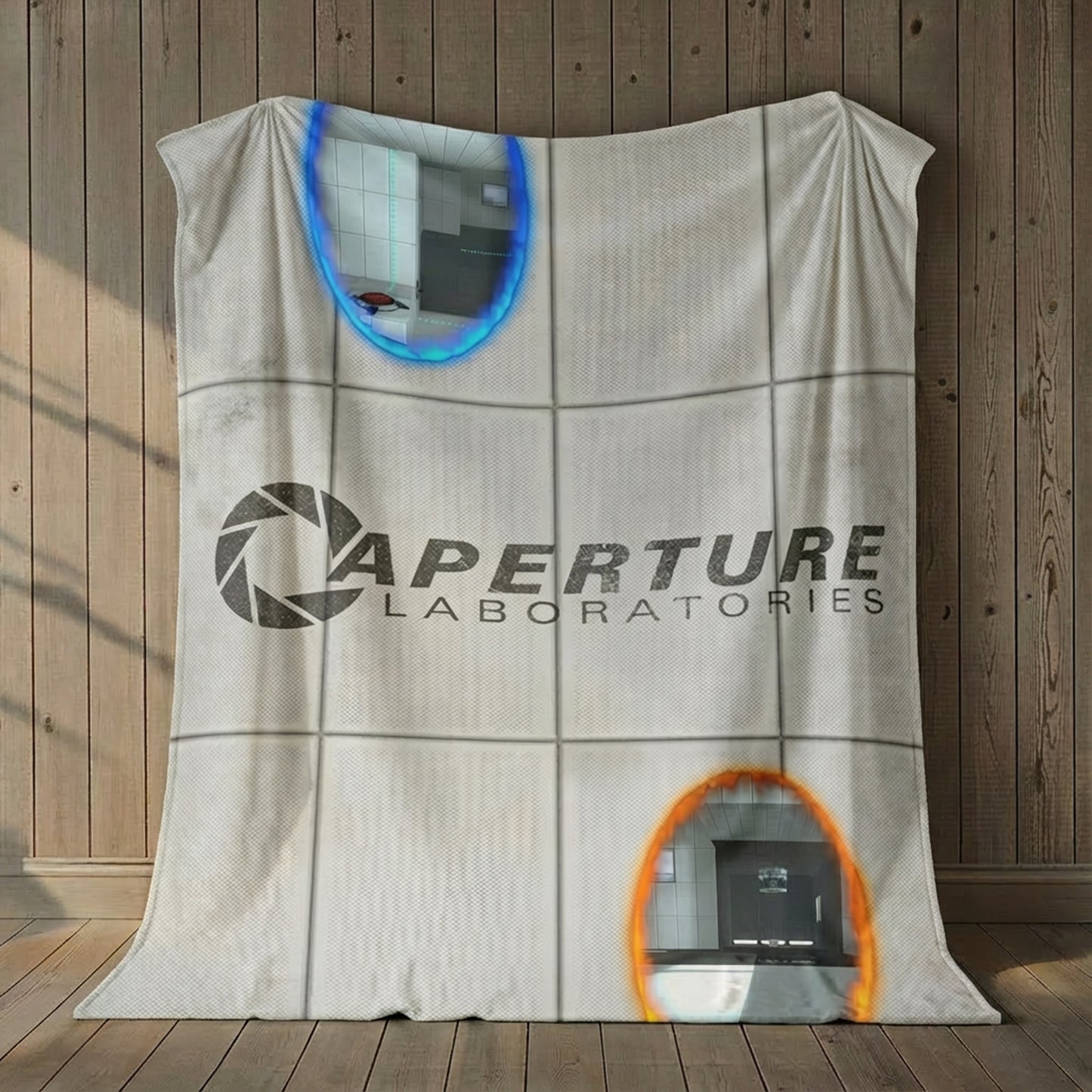60x80 Velveteen plush blanket with Portal 2 panel wall, Aperture Laboratories logo, and blue and orange portals, shown hanging on a wall.
