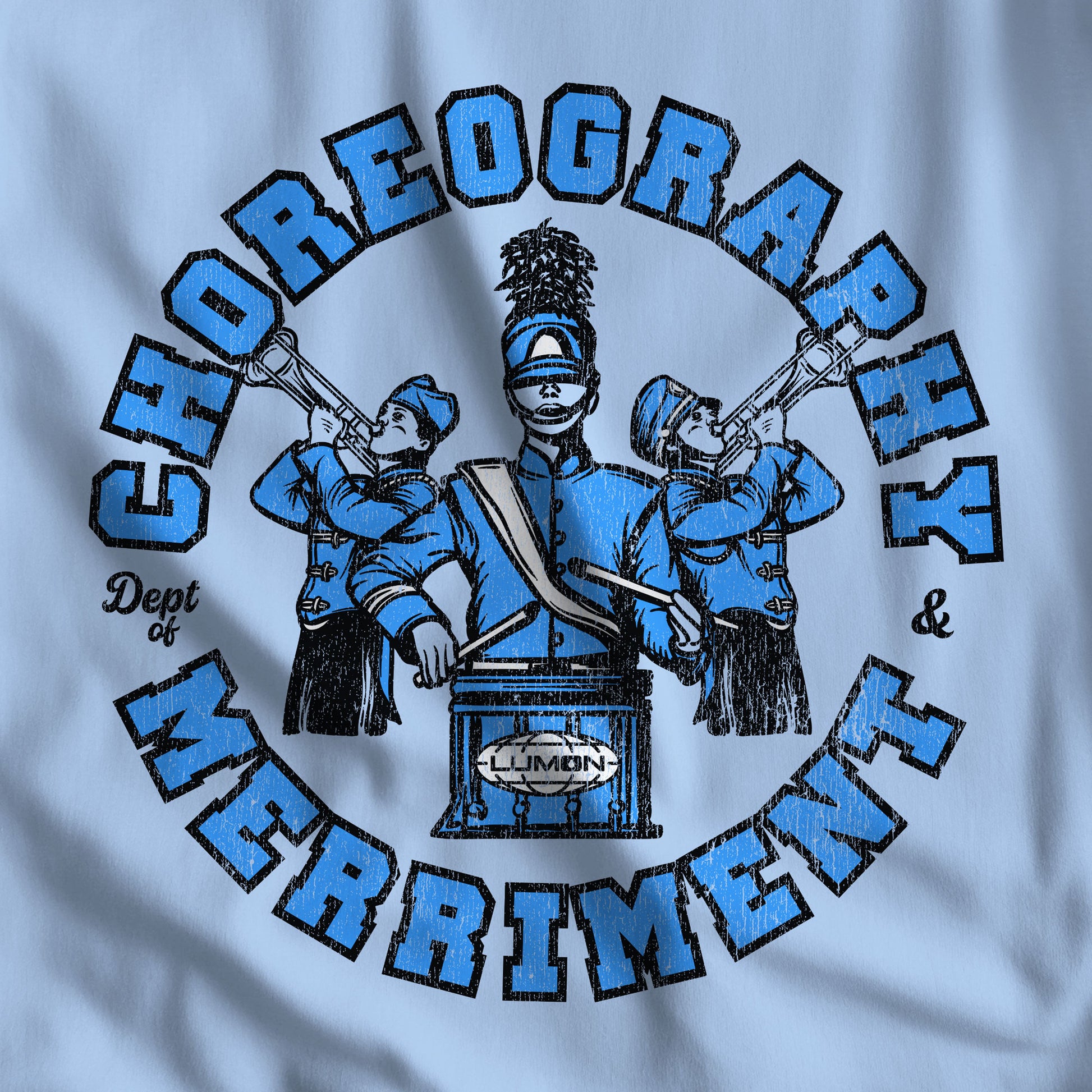Closeup of light blue tee with vintage distressed Lumon Dept of Choreography and Merriment marching band art