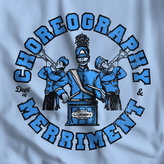 Closeup of light blue tee with vintage distressed Lumon Dept of Choreography and Merriment marching band art