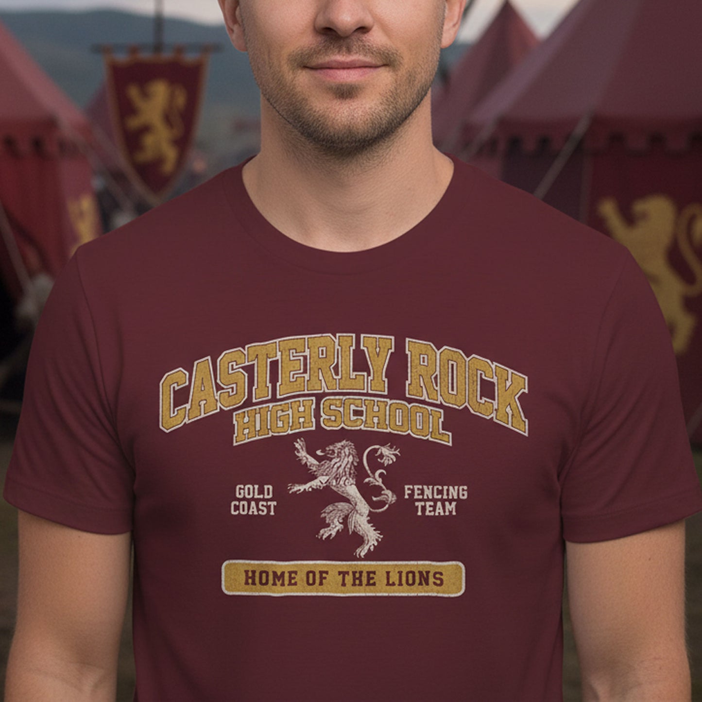 Person wearing maroon Casterly Rock High School t-shirt with vintage lion graphic inspired by Game of Thrones.